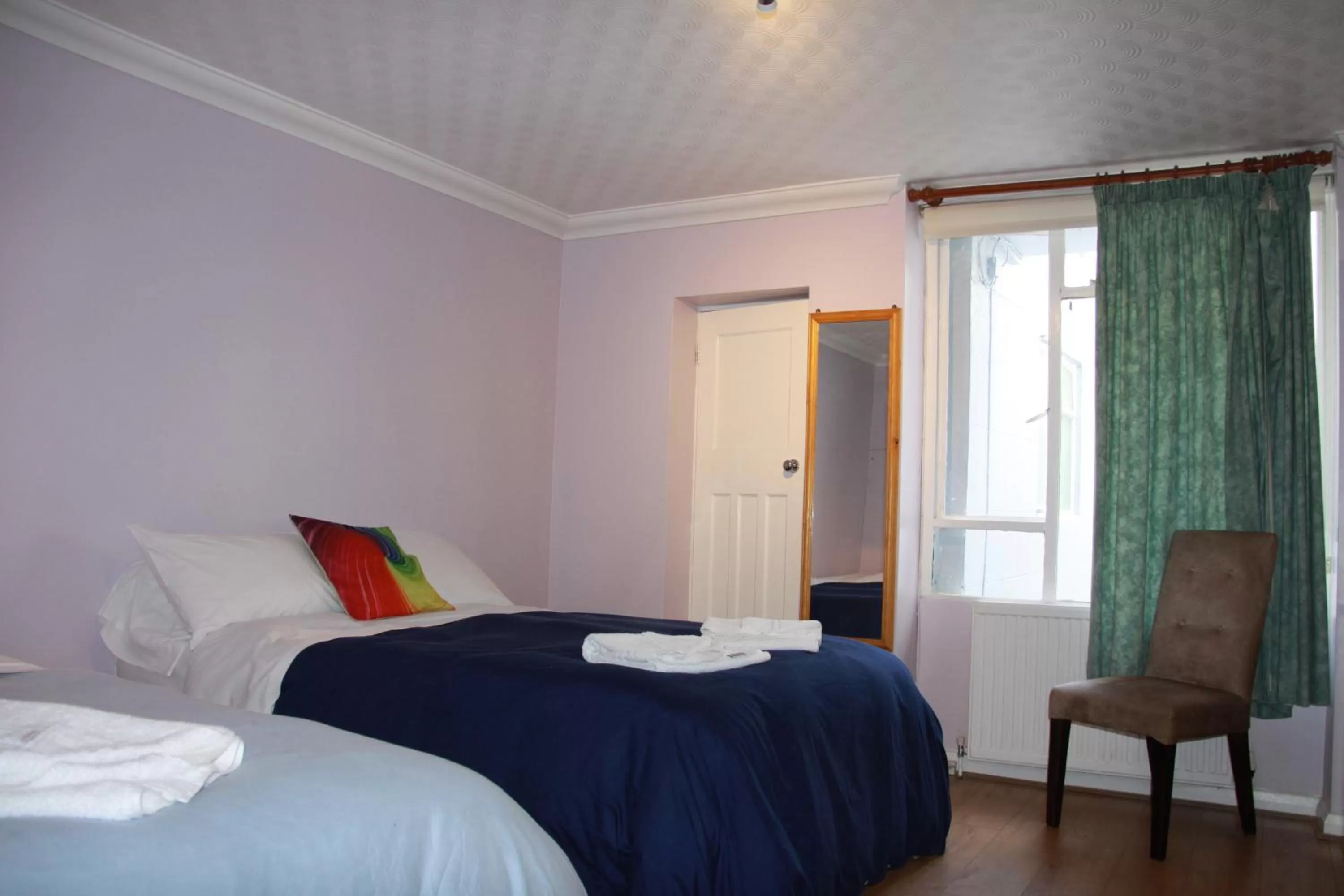 Bed in Ambassador Hotel