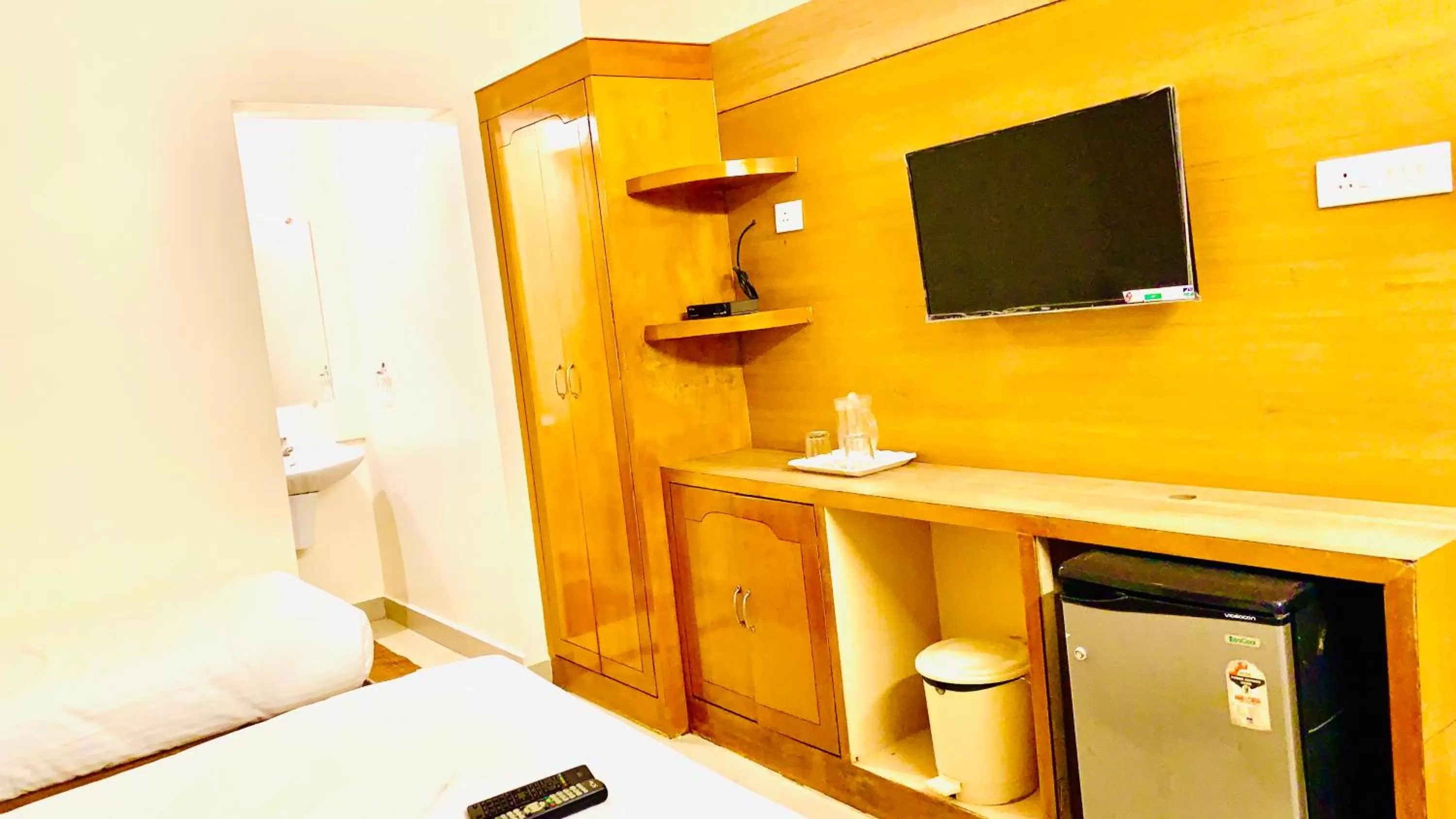 Communal lounge/ TV room in Half Moon Palace Chennai