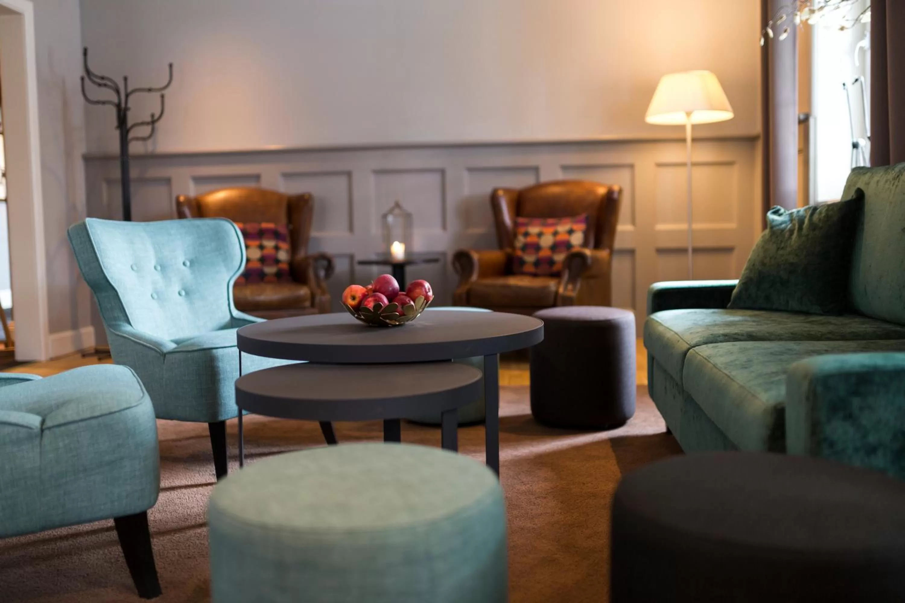 Communal lounge/ TV room in Clarion Collection Hotel Uman