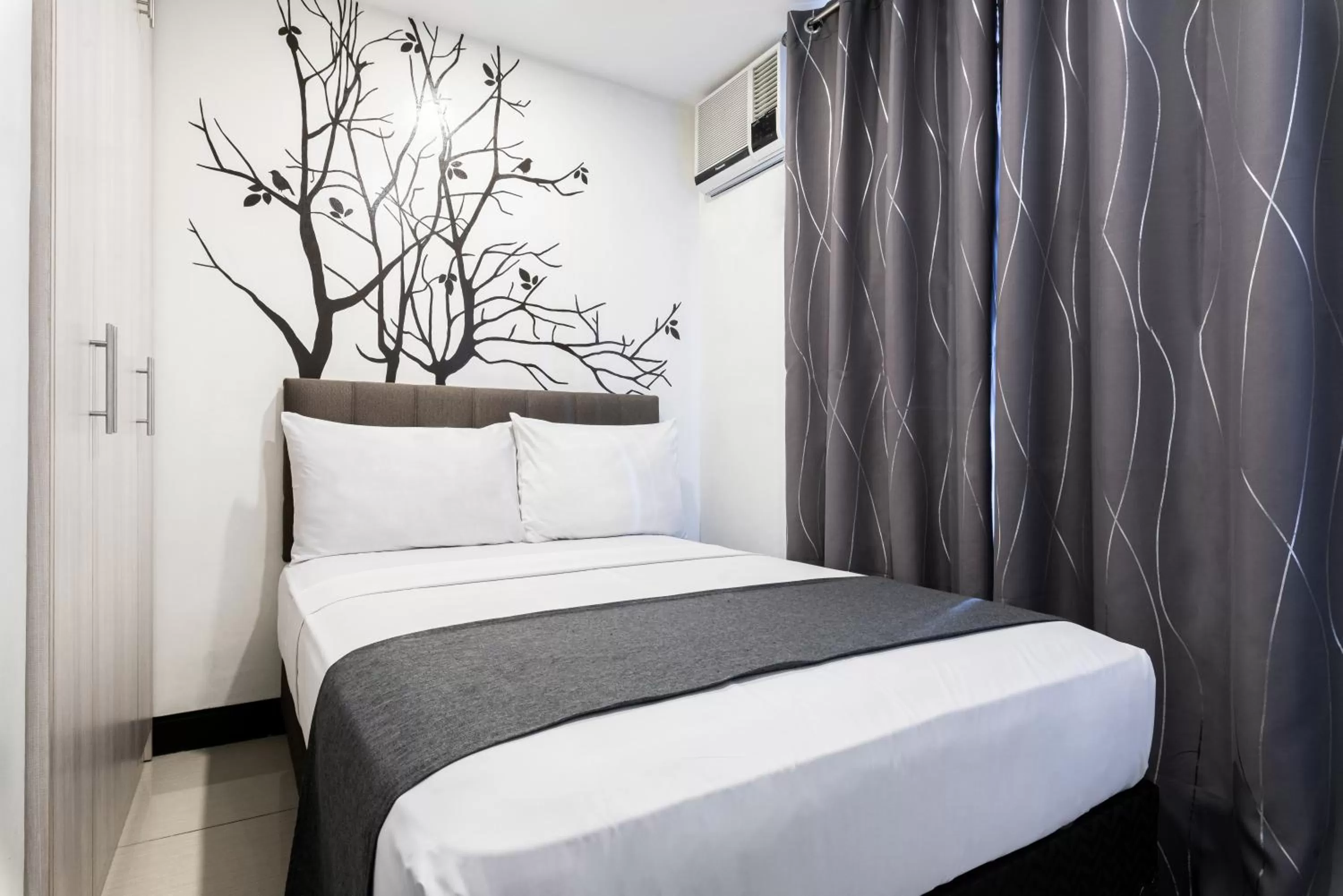 Bedroom, Bed in Artemis Place Makati Hotel