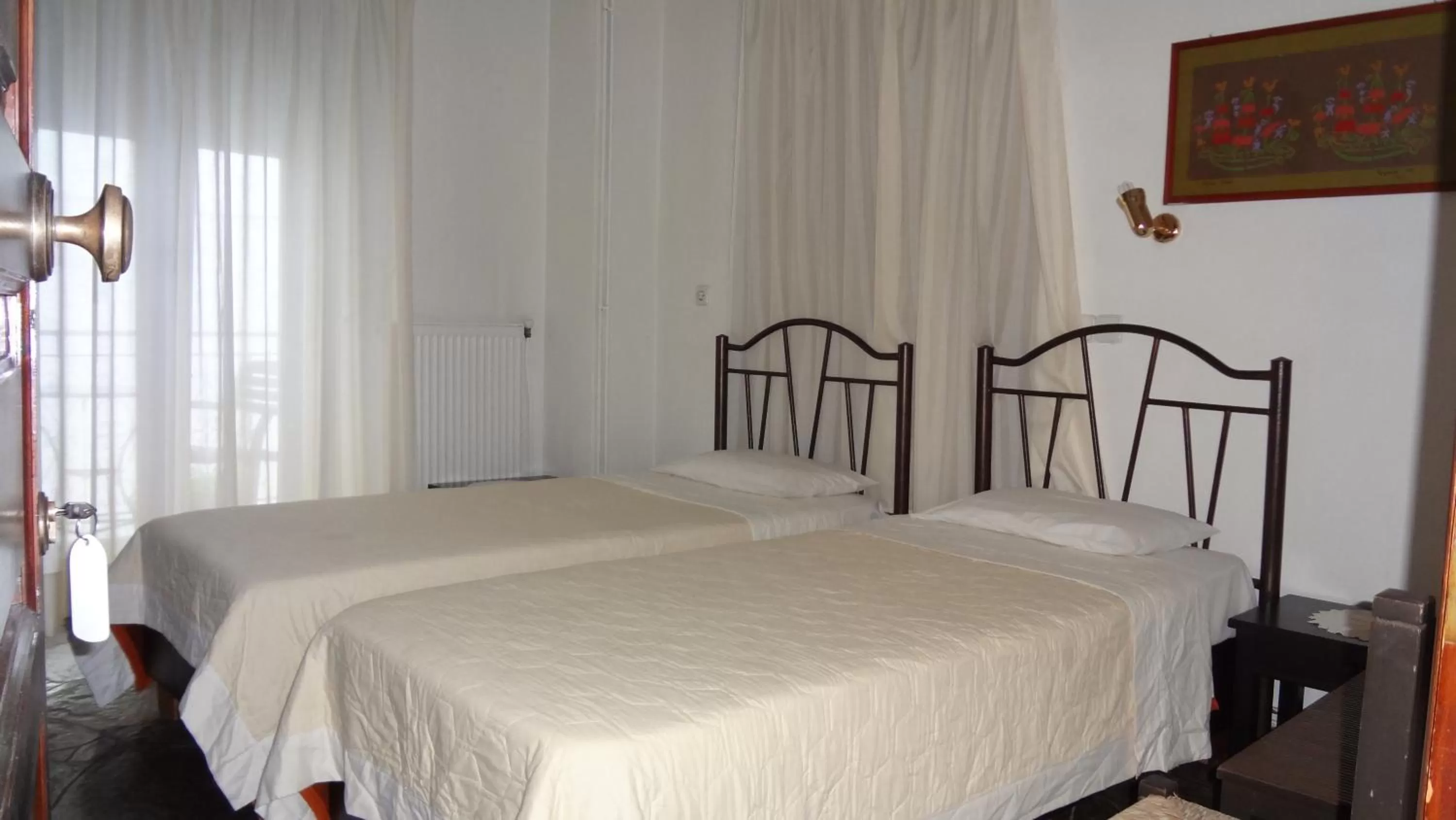 Bed in Acropolis Hotel