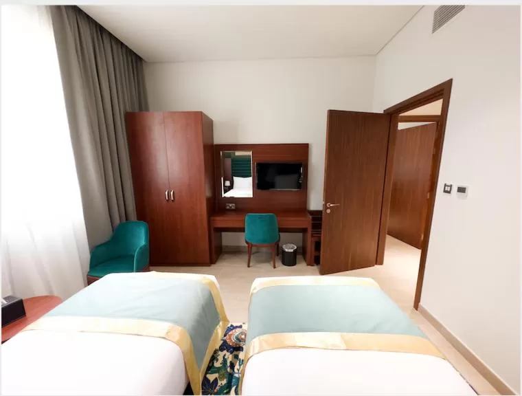 Bed in BANIYAS PLAZA HOTEL APARTMENTS