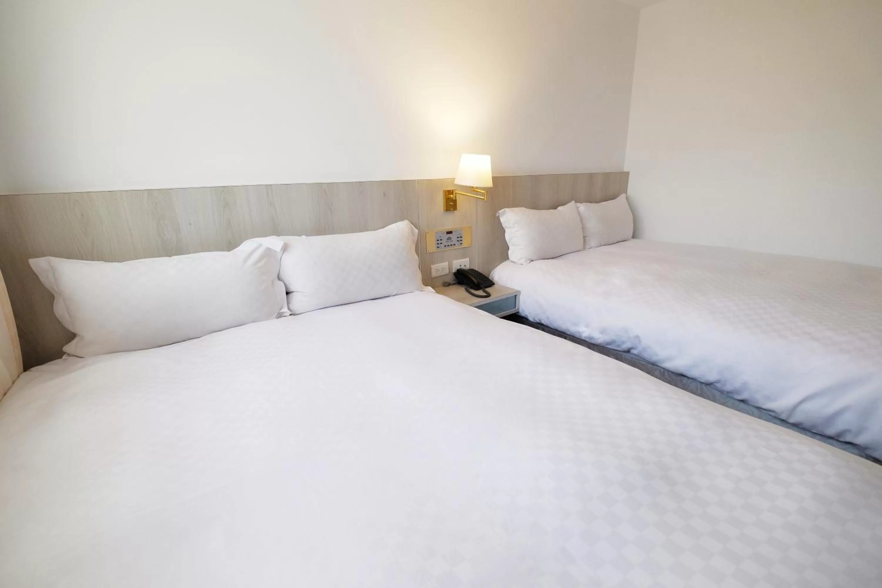 Bed in Dynasty Hotel