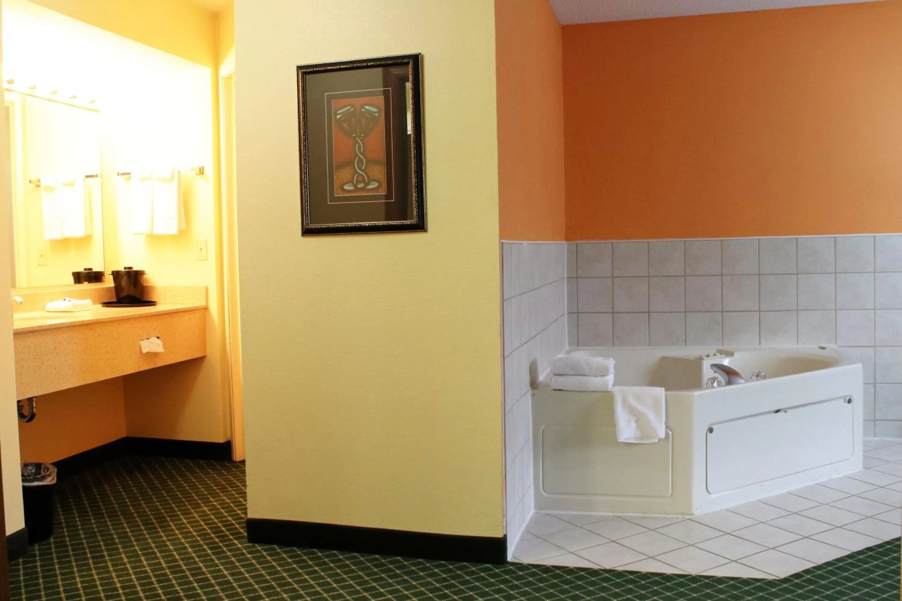 Bathroom in Days Inn & Suites by Wyndham Bloomington/Normal IL