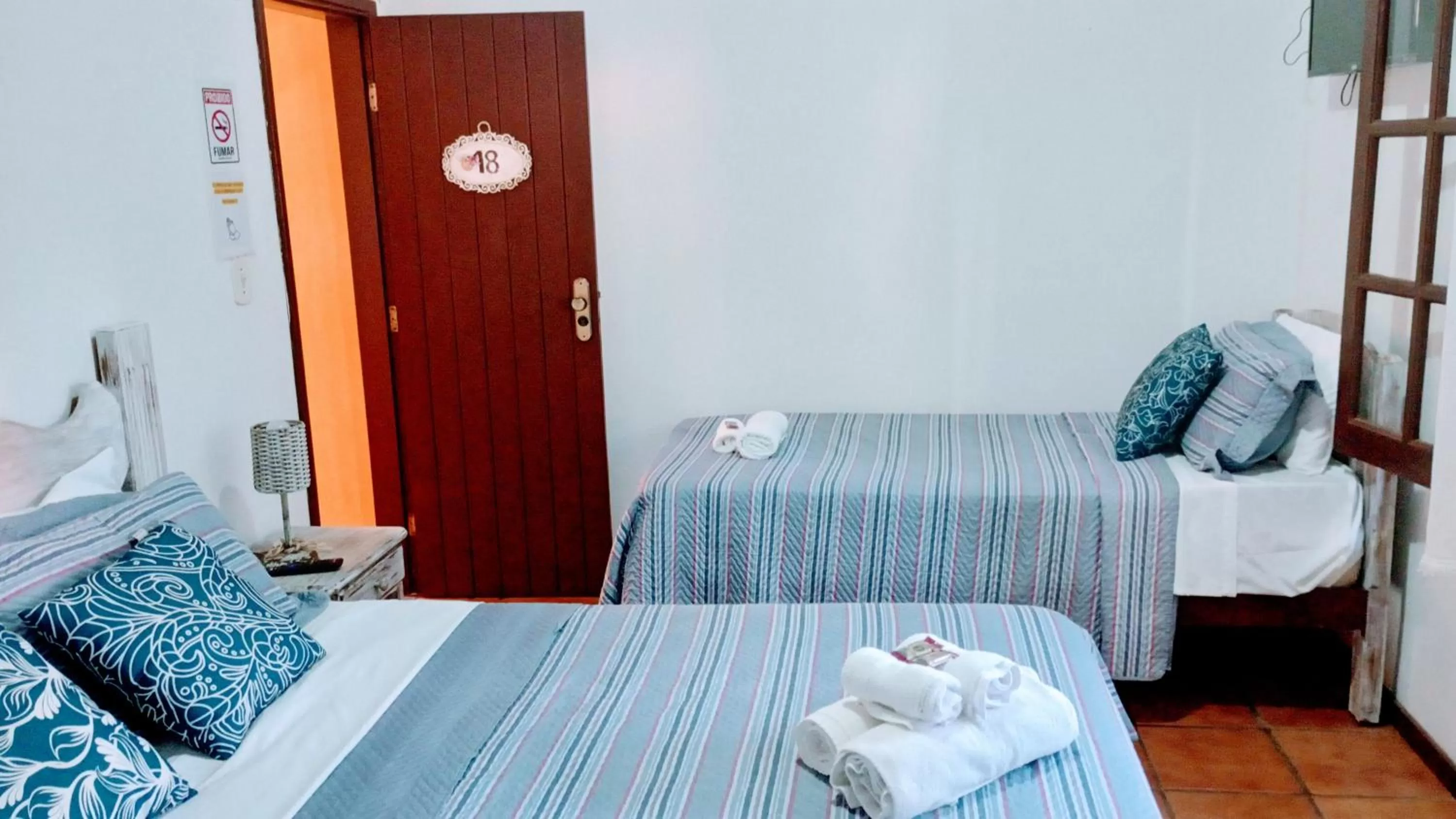 Bed in Hibiscos Pousada