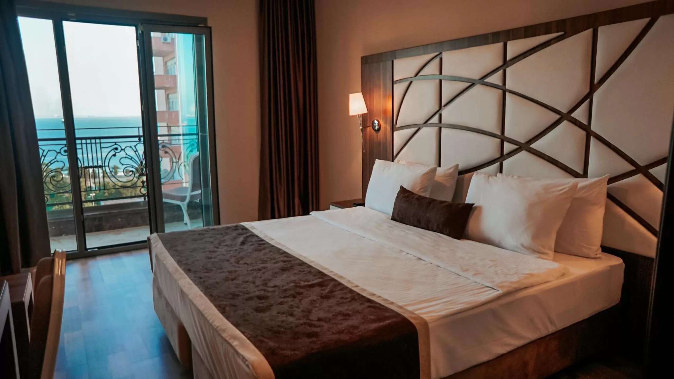 Bed in The Grand Mira Business Hotel