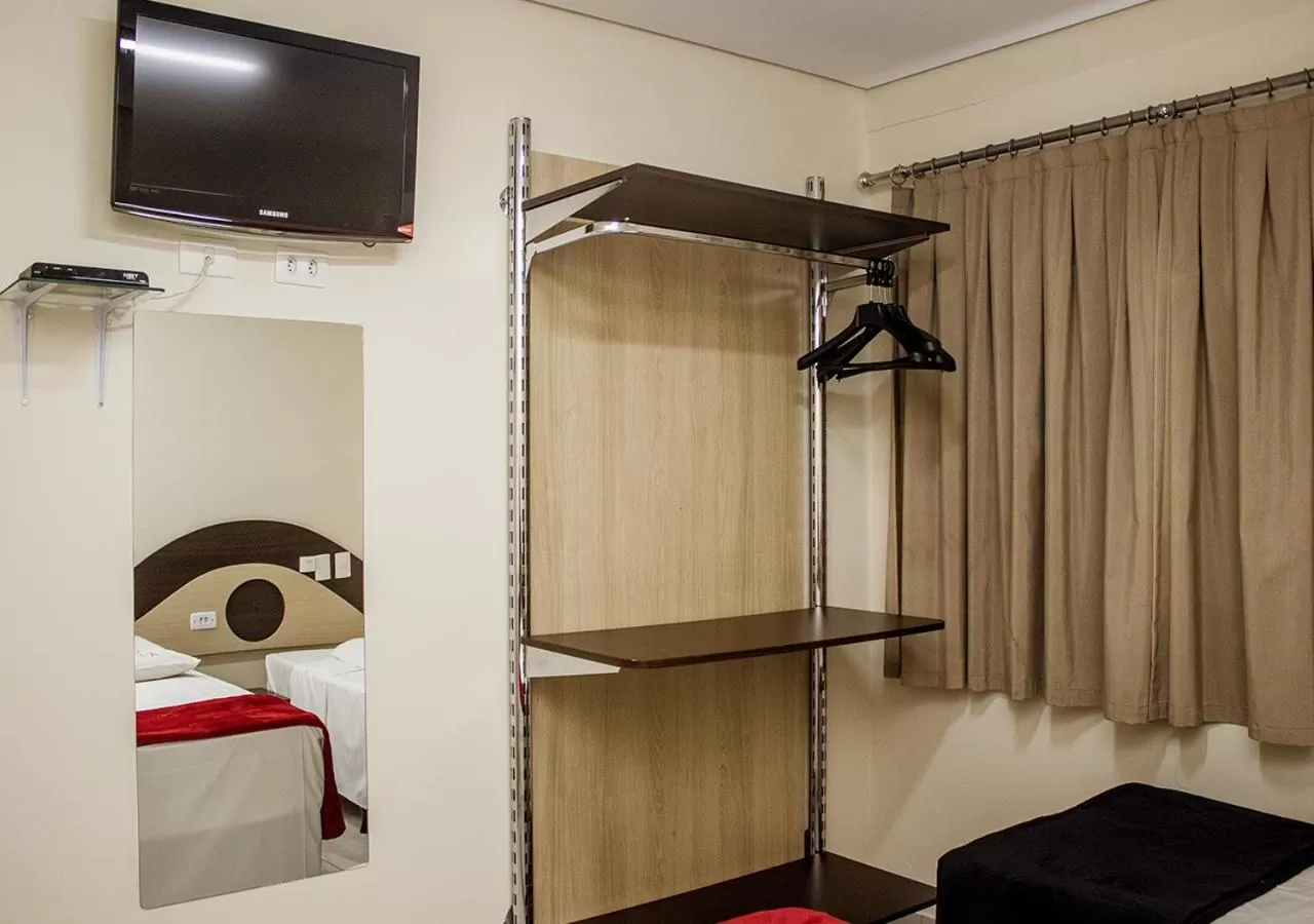 Bed, TV/Entertainment Center in Alkimia Hotel