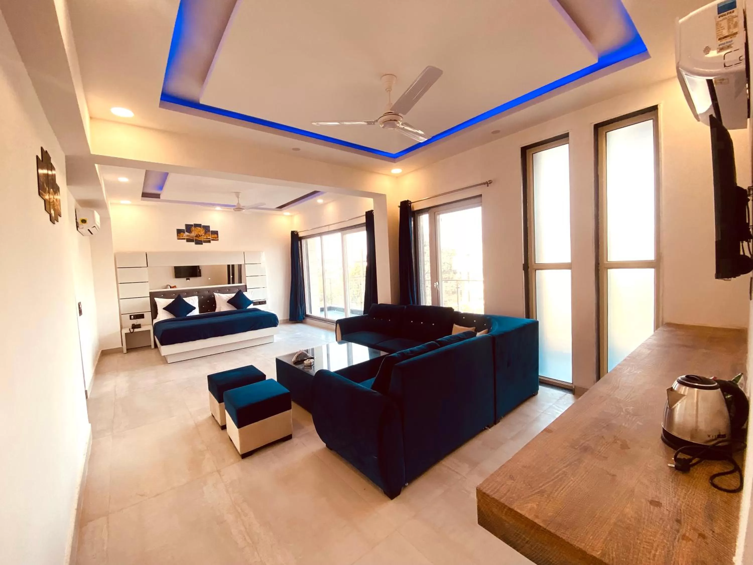 Bedroom, Seating Area in The Metro Stay By F9 Hotels-Near Sector 18 Metro Station Noida