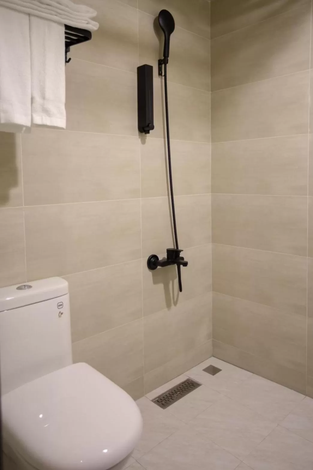 Toilet in The Rooms Inn