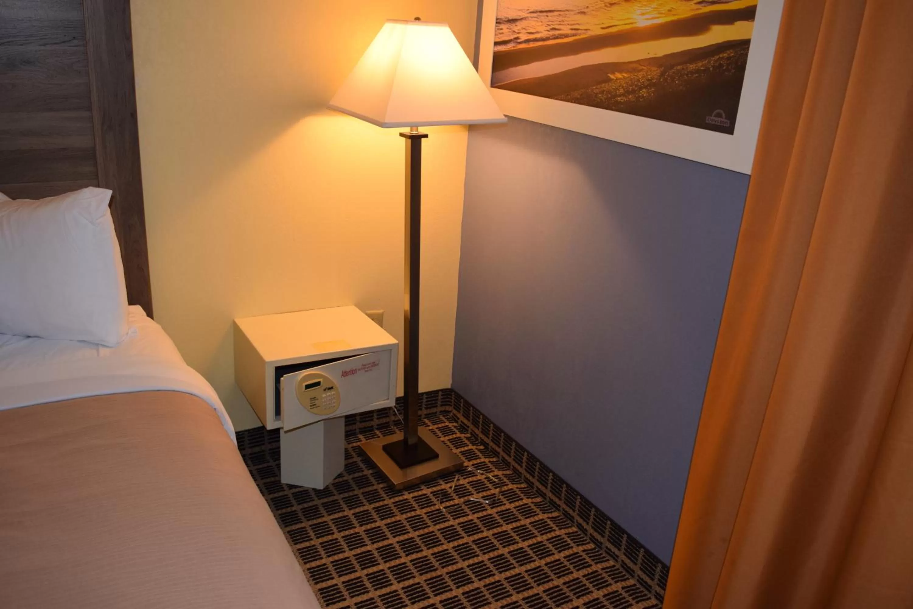 Bed in Days Inn by Wyndham Cadillac