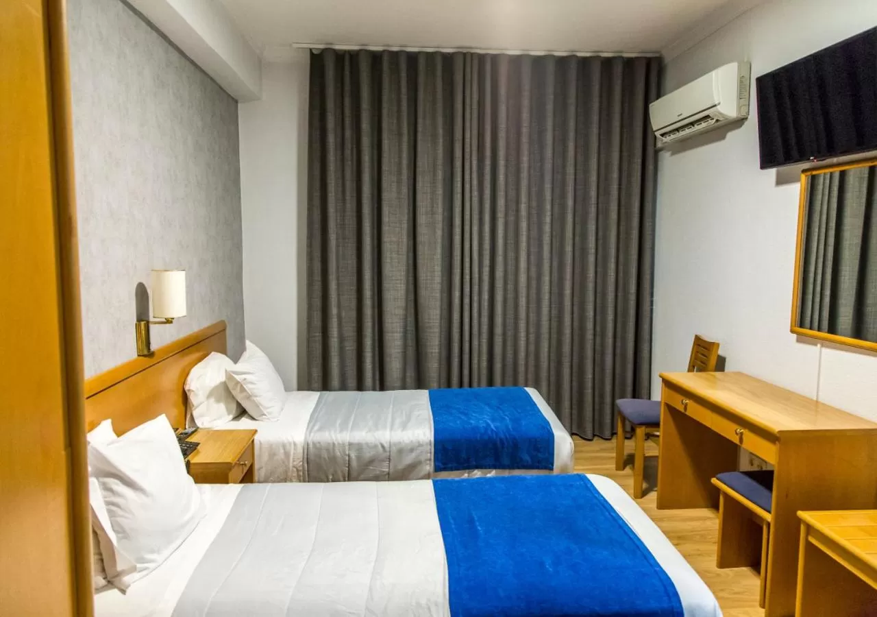 Bed in Hotel Columbano