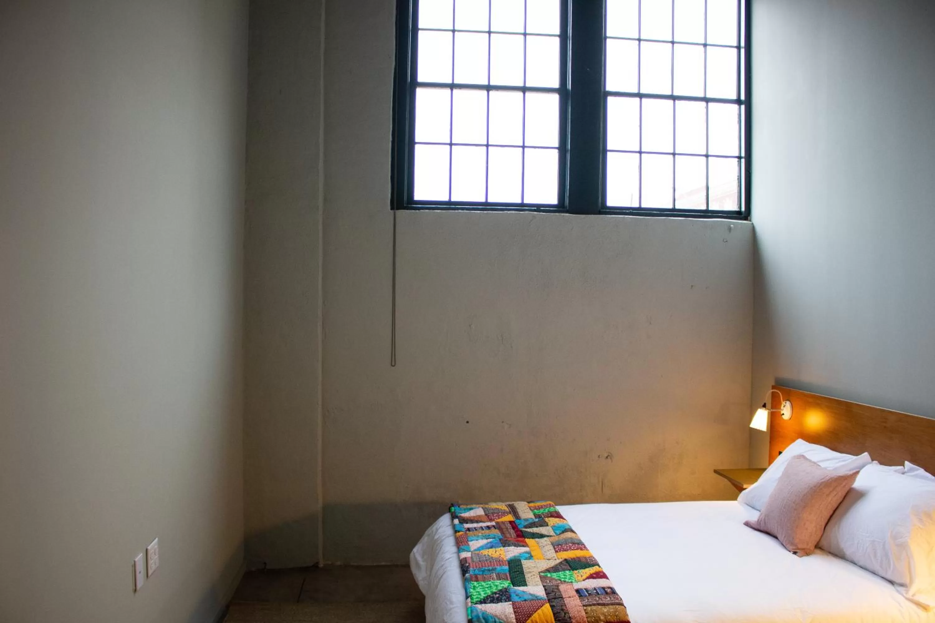 Bed in Travelers Hotel