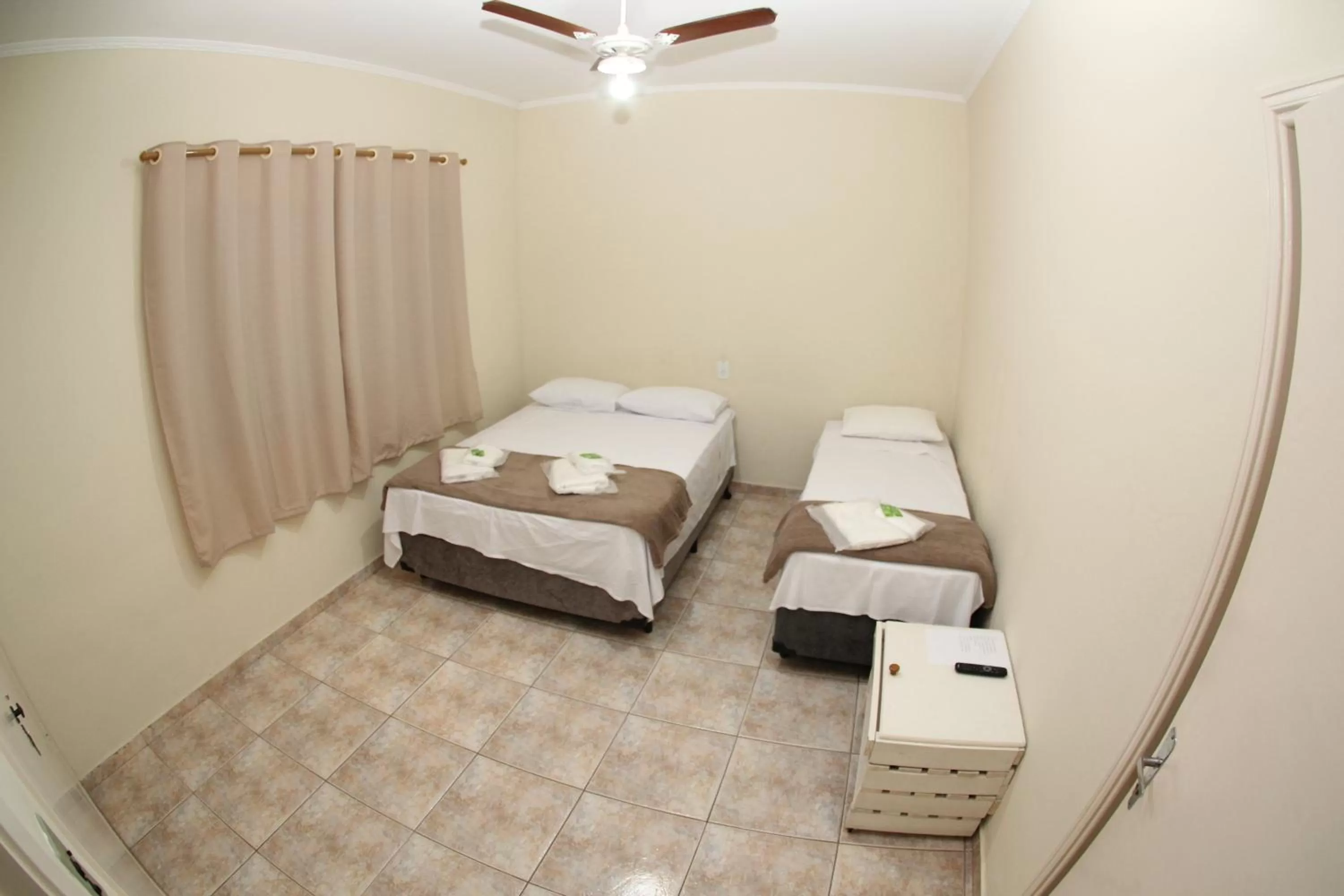 Bed in Pousada Santa Genebra