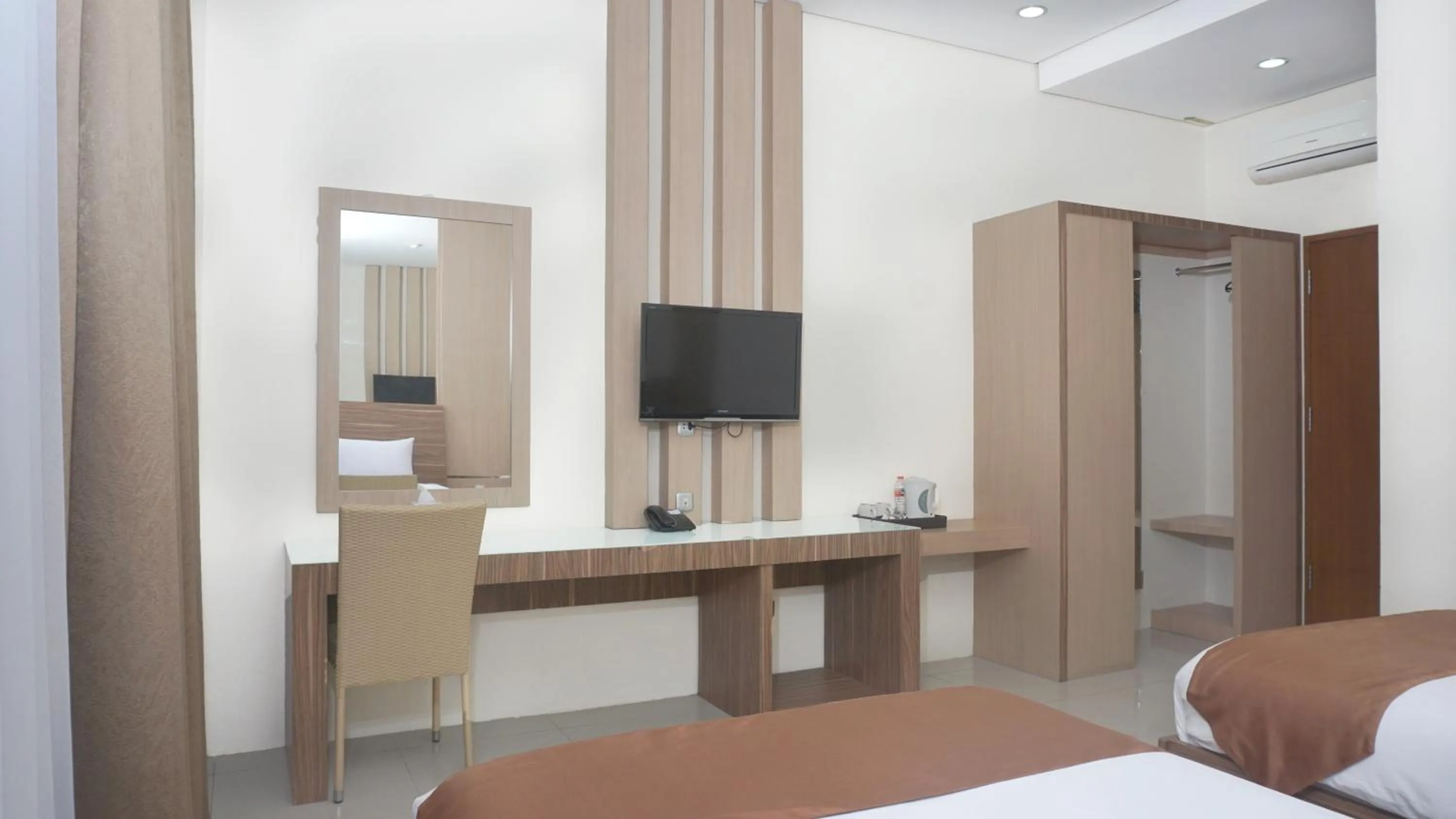 Photo of the whole room, Bed in Grand Cordela Hotel AS Putra Kuningan