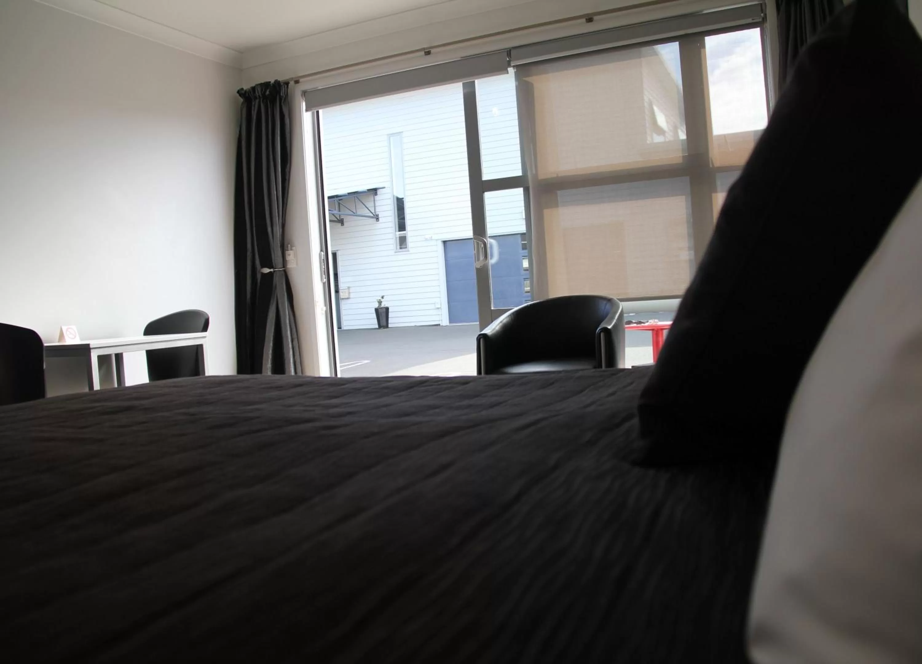 View (from property/room), Bed in Pukekura Motor Lodge