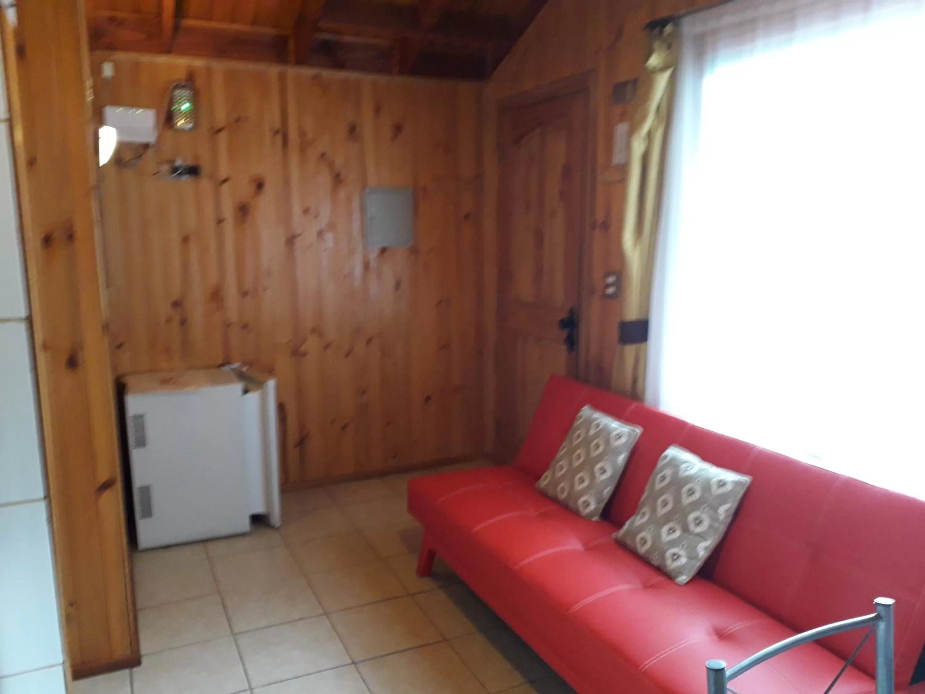 Living room in Apart-Hotel Colonia-Königsberg UBICADO COSTADO TERMINAL BUSES, RÍO CALLE CALLE CARABINEROS DEPARTAMENTOS COMPLETOS CON AIRE ACONDICIONADO Y ESTACIONAMIENTO