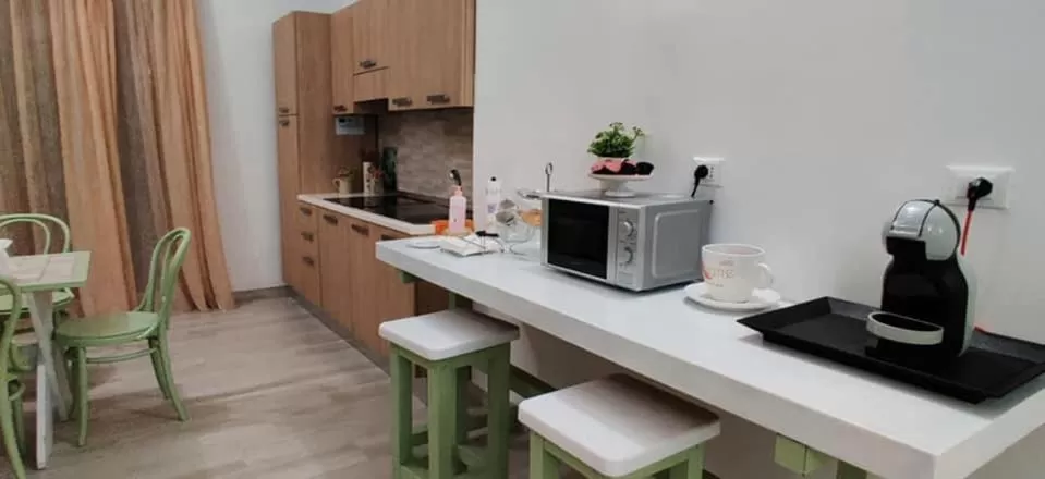 Communal lounge/ TV room in Musa B&B