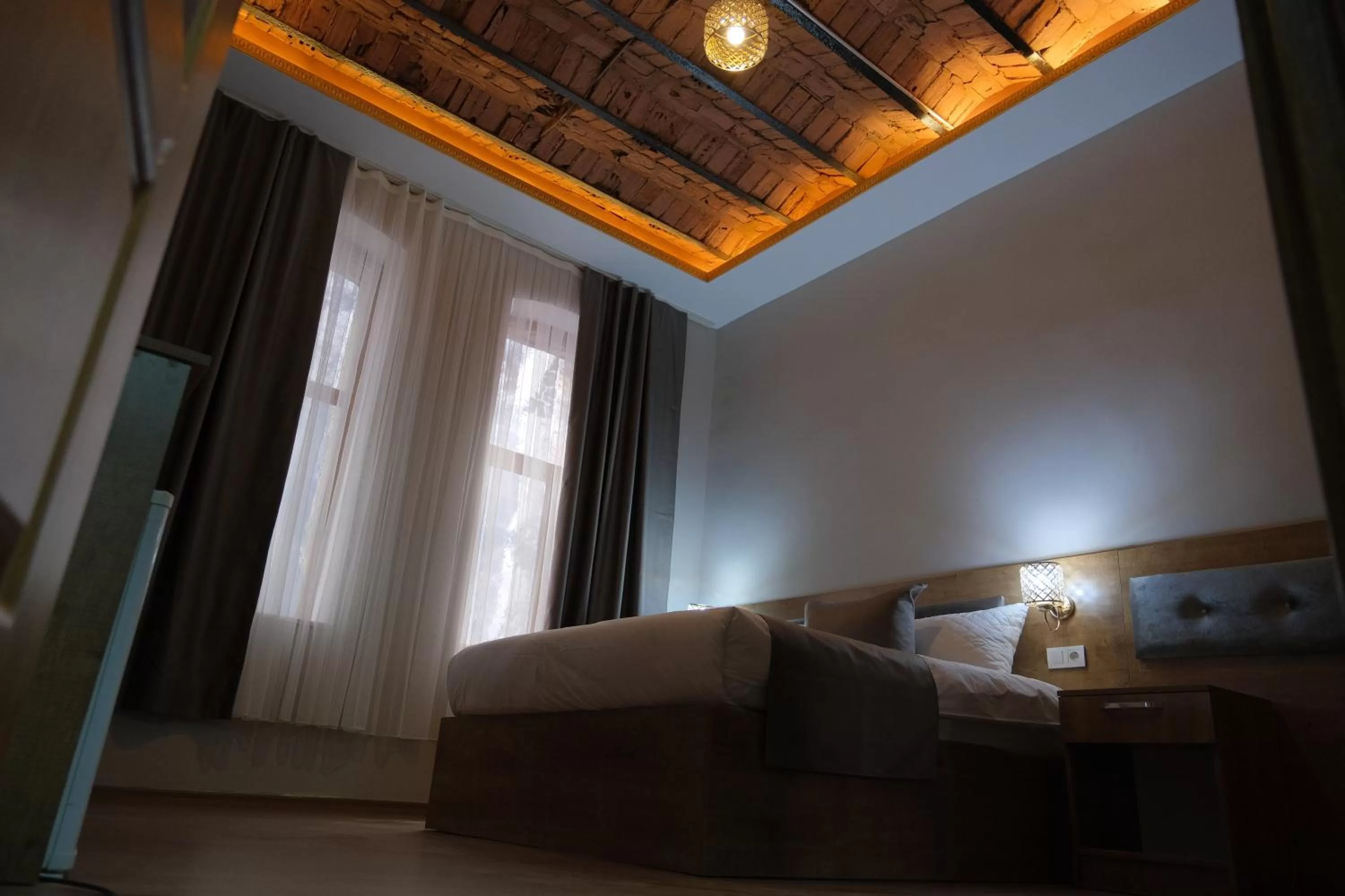 Bed in Adamantides Hotel