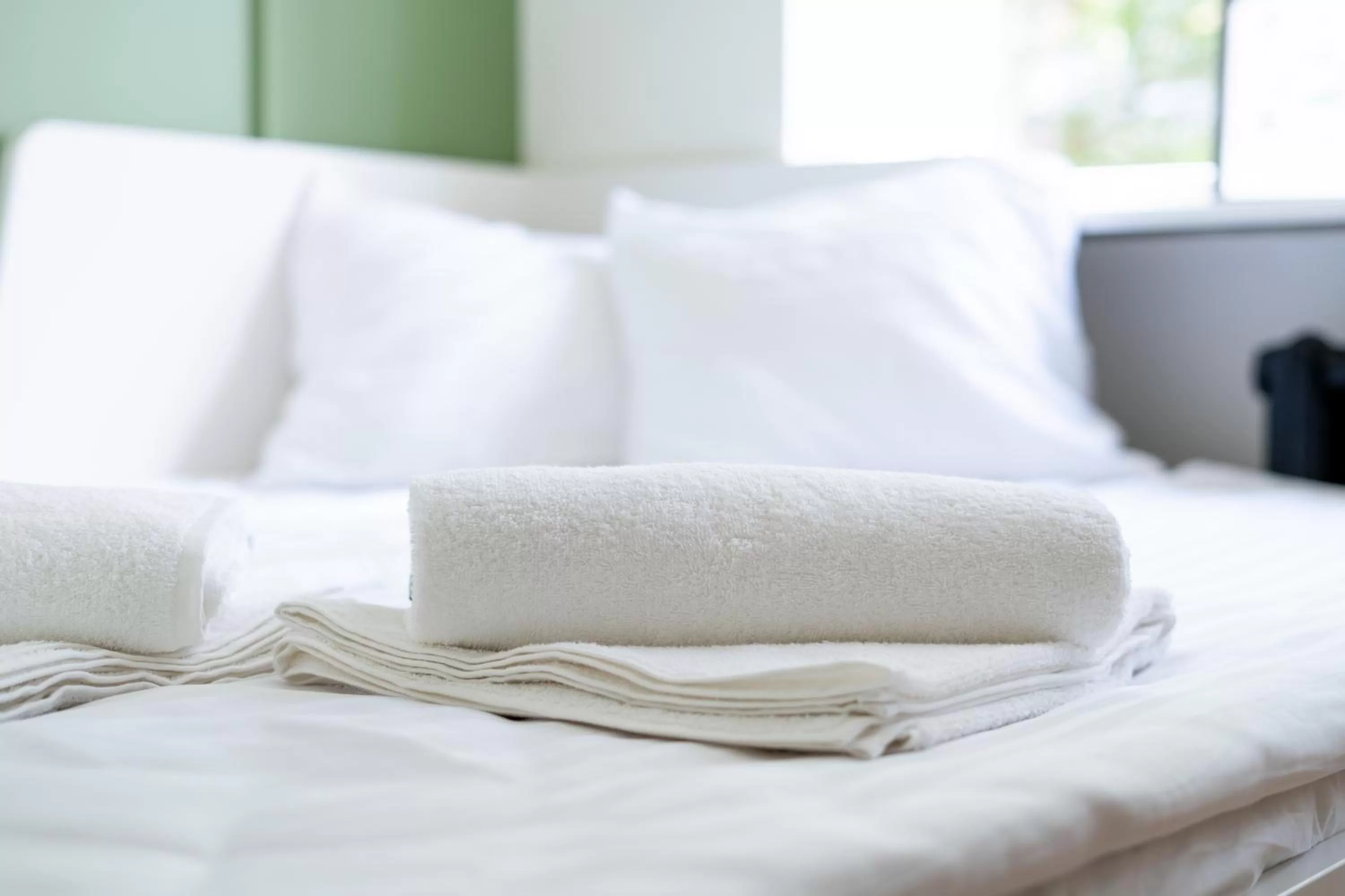 Bed in Oasis Airport Studios by RevalHome