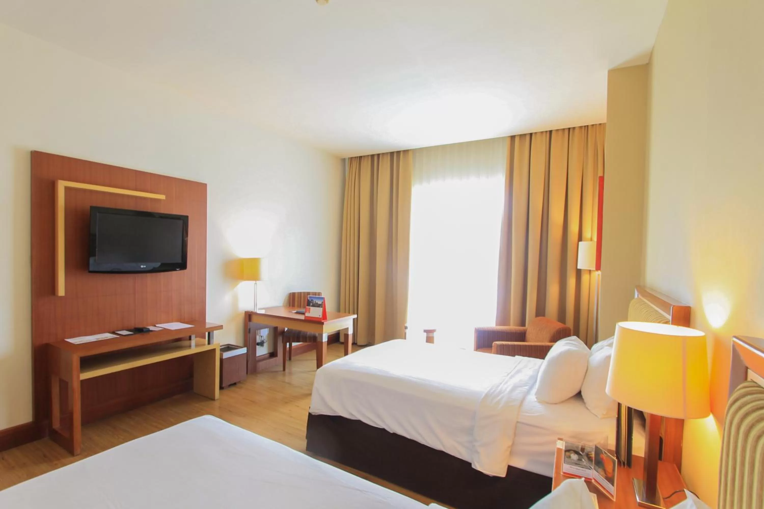 Bed in Swiss-Belhotel Maleosan Manado