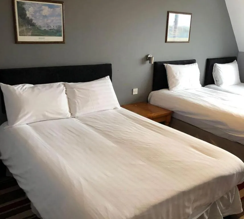 Bed in The Airman Hotel