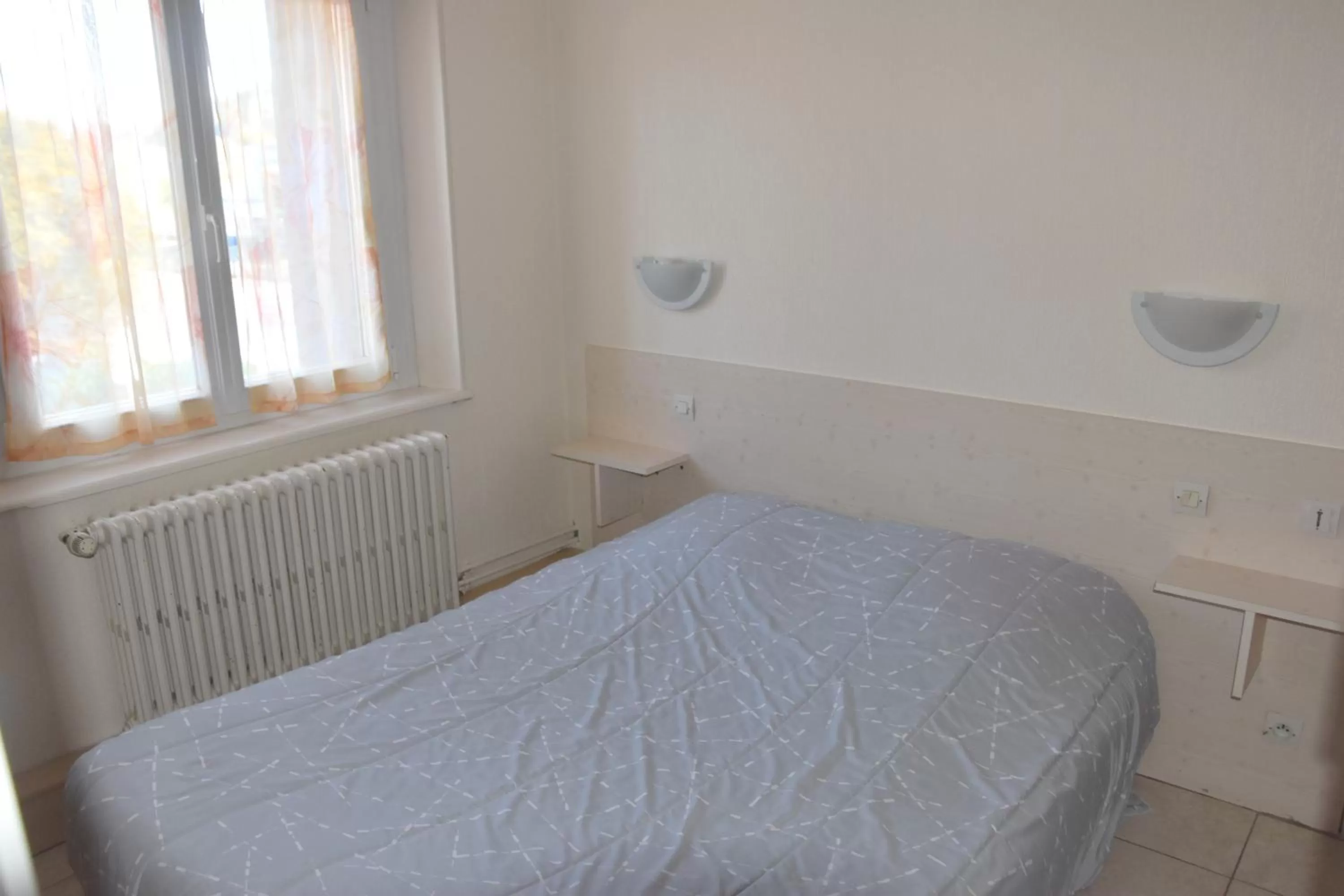 Bed in Hotel Gai Relais