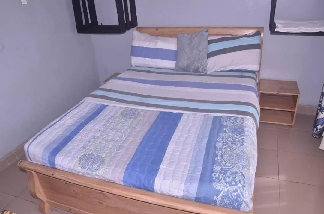 Bed in Tommy's Budget Rooms