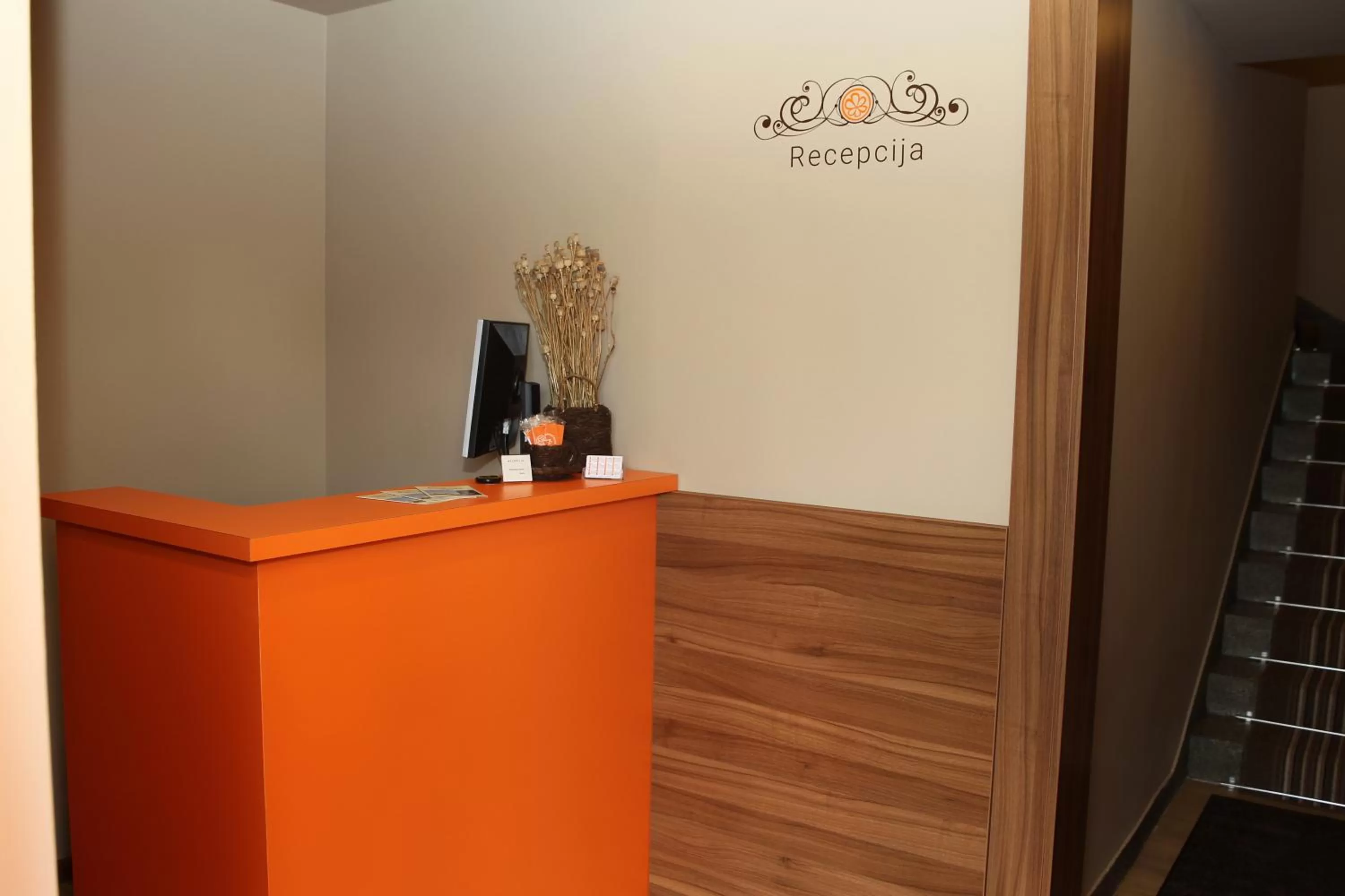 Property logo or sign in Hotel Pomaranča