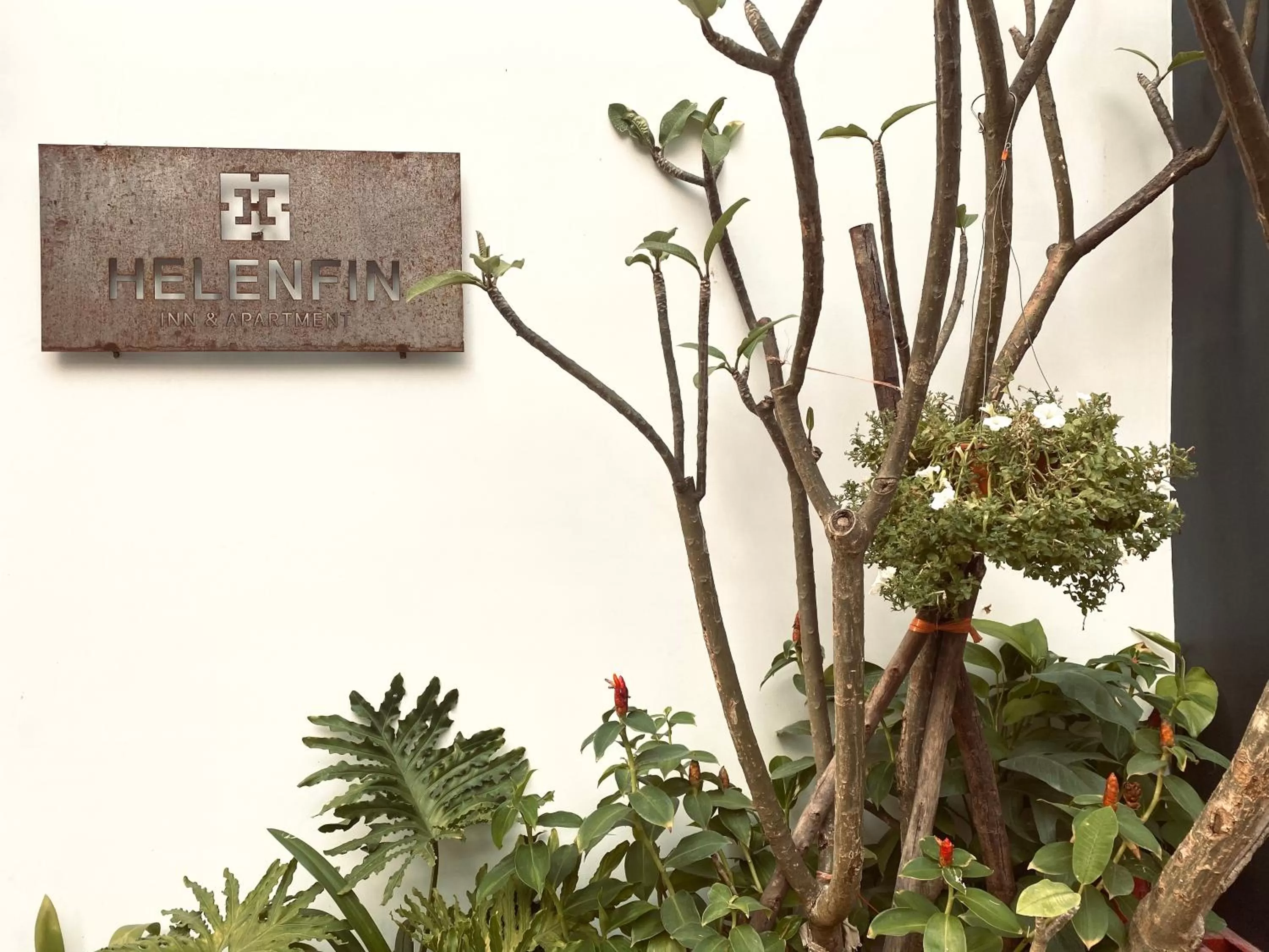 Property logo or sign in Helen Fin Inn & Apartment