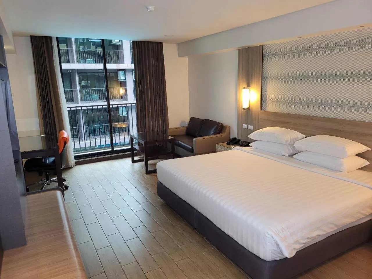 Bed in Dynasty Grande Hotel