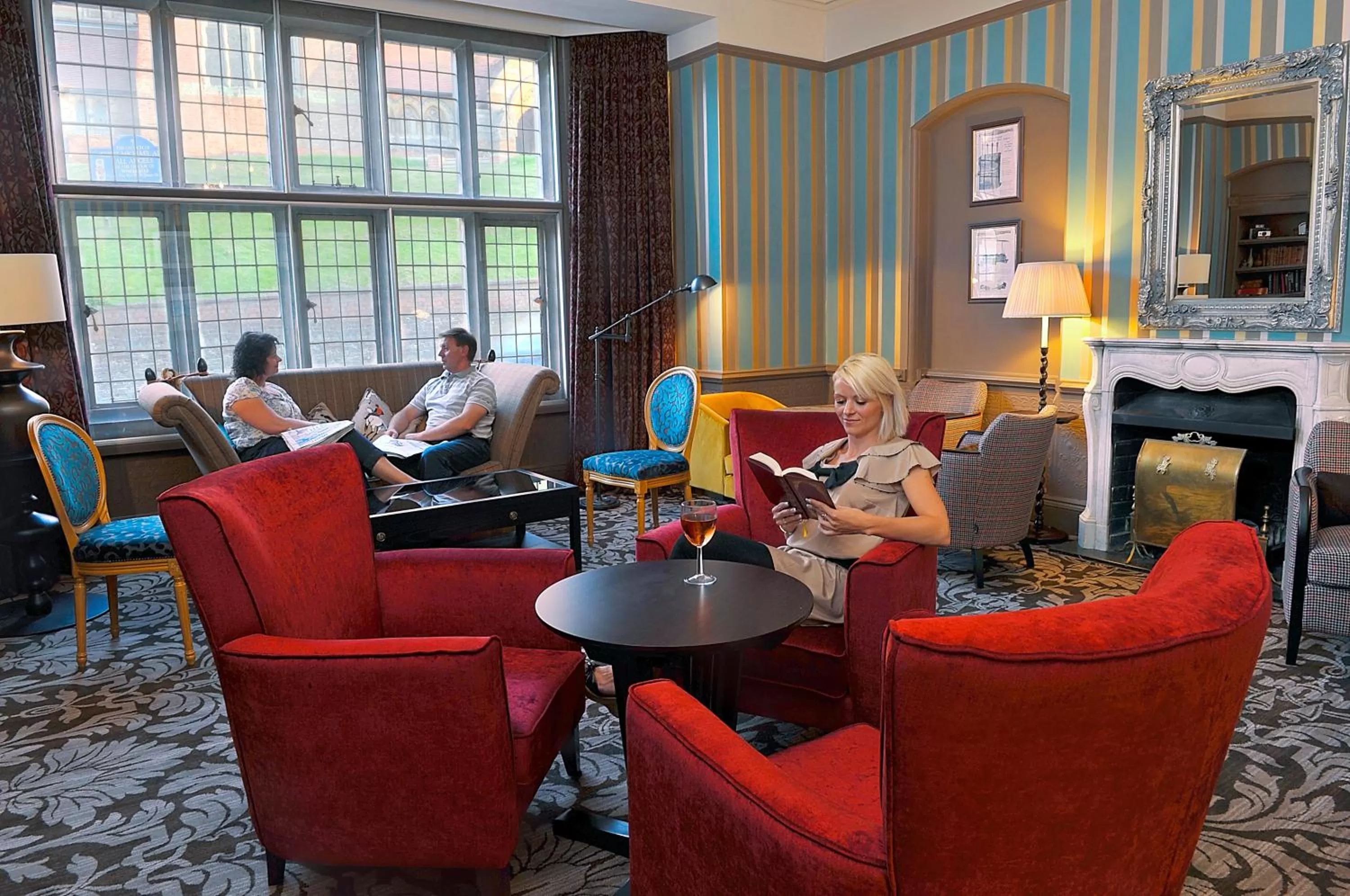 Communal lounge/ TV room in The Crown Manor House Hotel