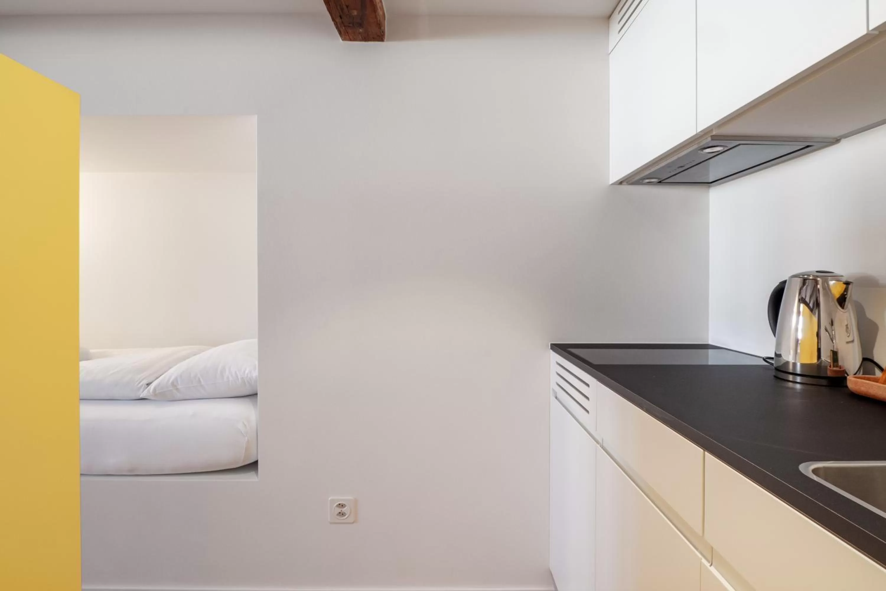 Kitchen or kitchenette, Bed in Linde Heiden Swiss Quality Hotel