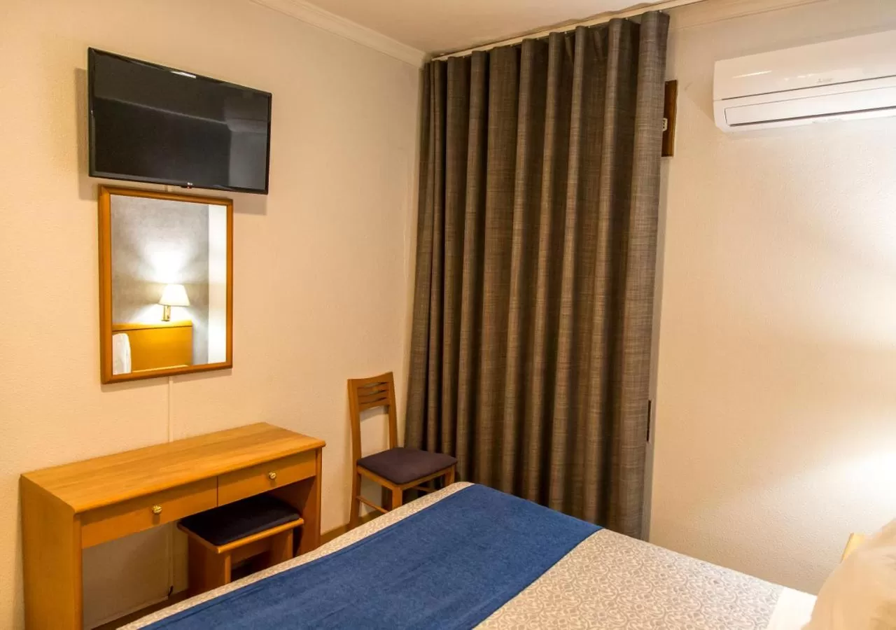 Bed in Hotel Columbano