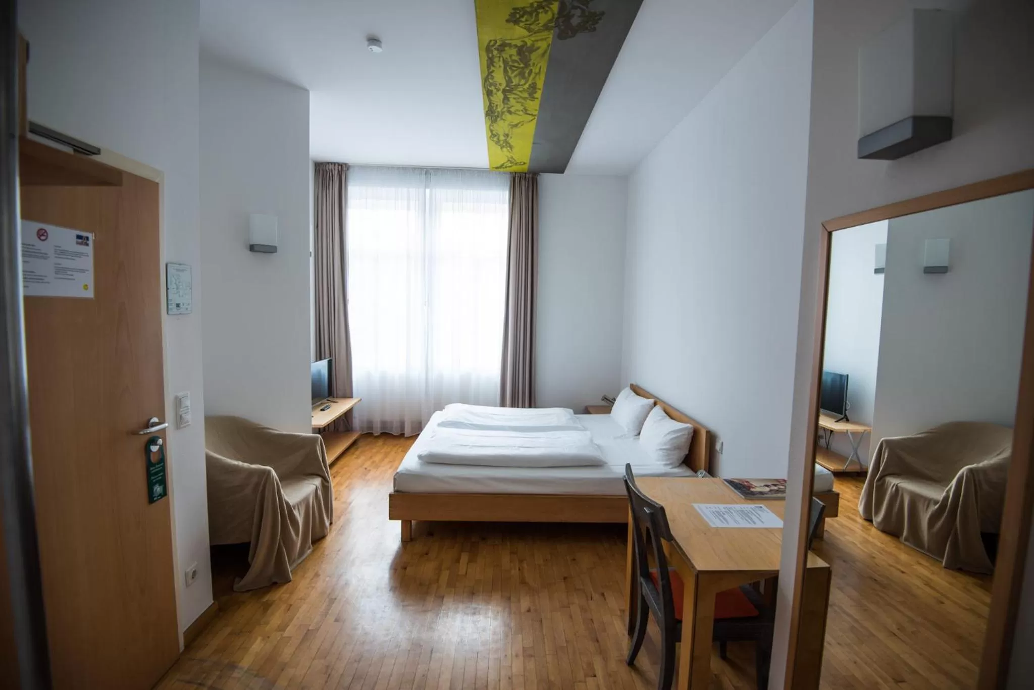 Bed in Art-Hotel Robert Mayer