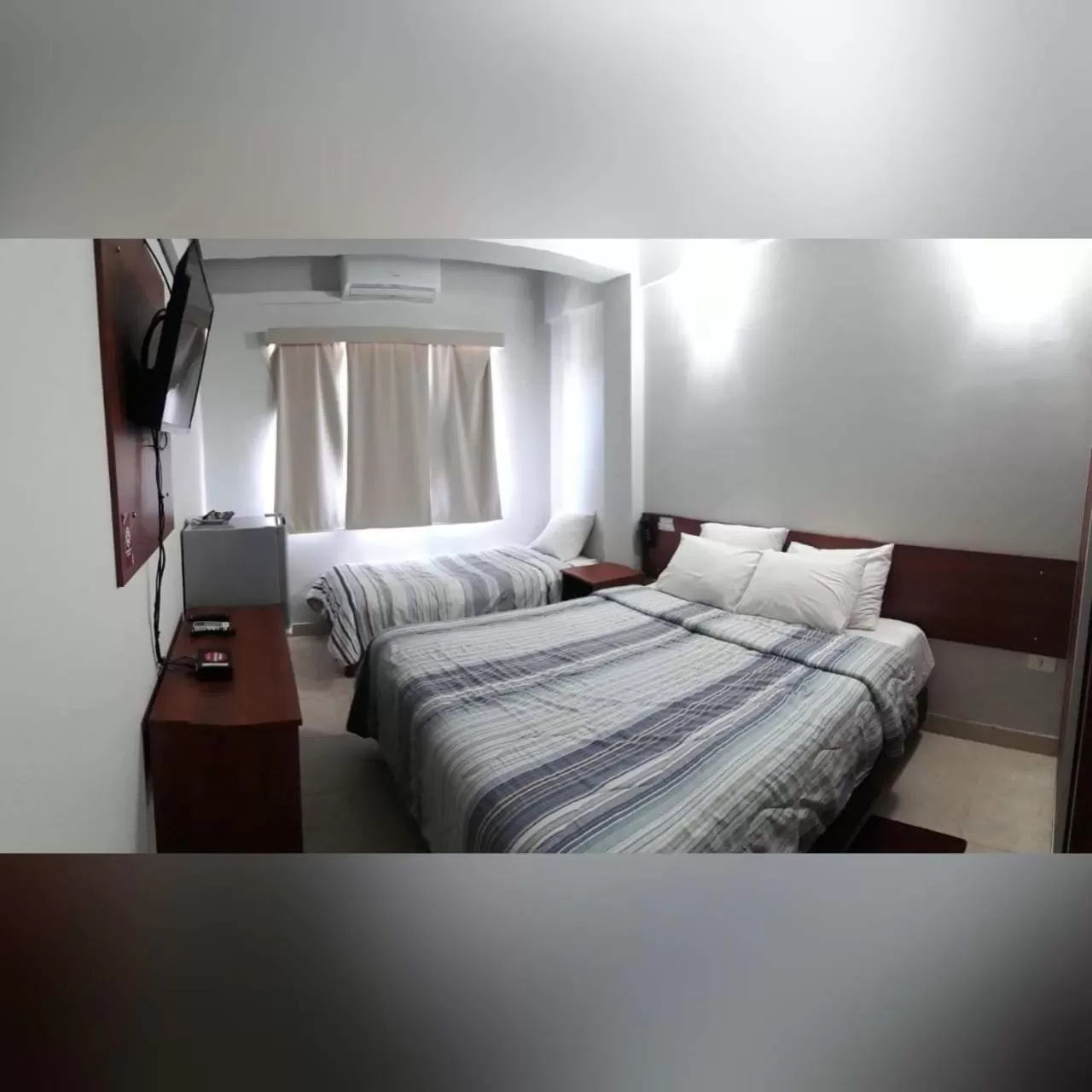 Bed in Madame Lynch Hotel Asuncion