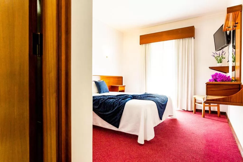 Bed in Dona Amélia Hotel by RIDAN Hotels