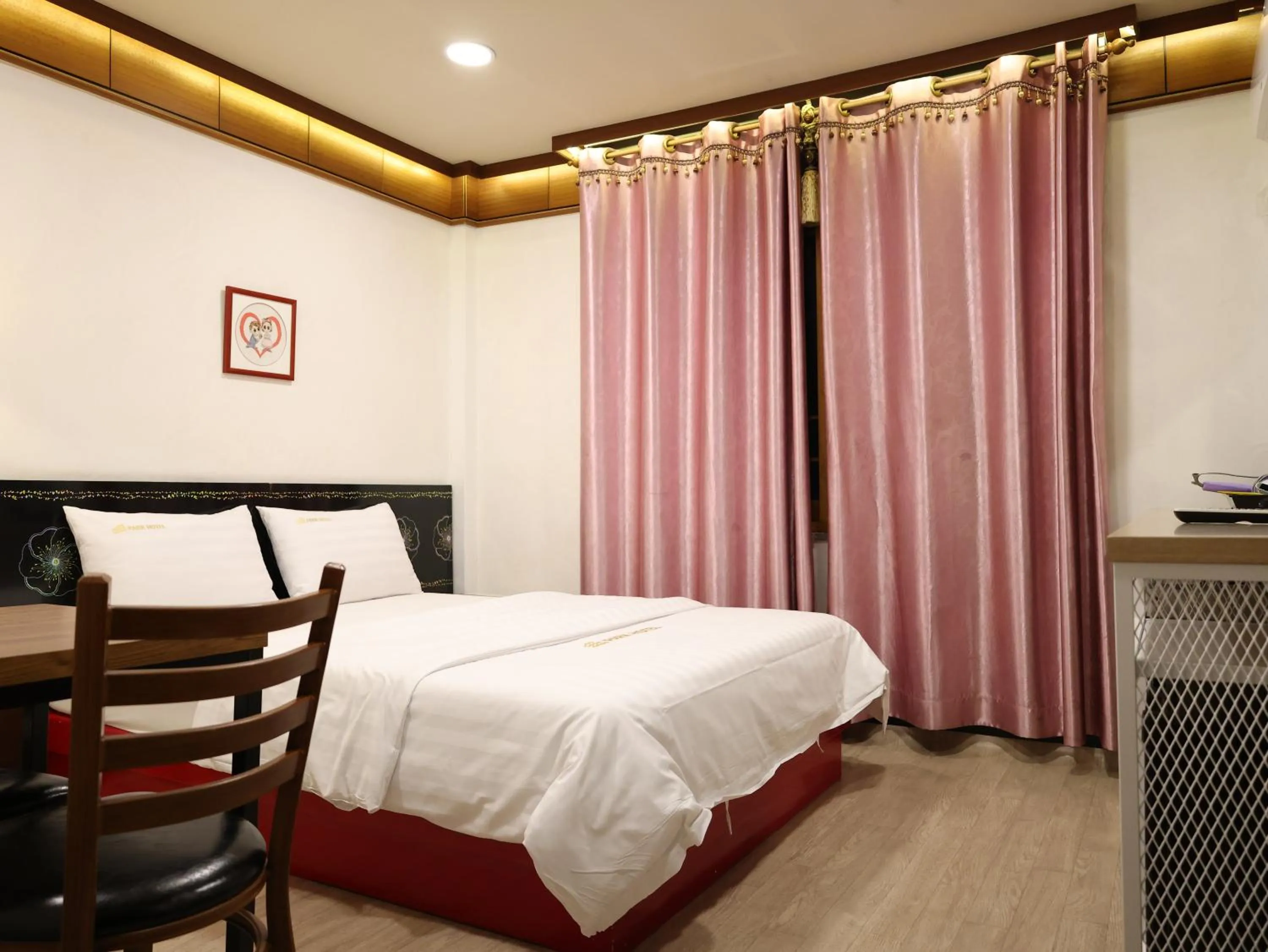 Bed in Goodstay Andong Park Hotel