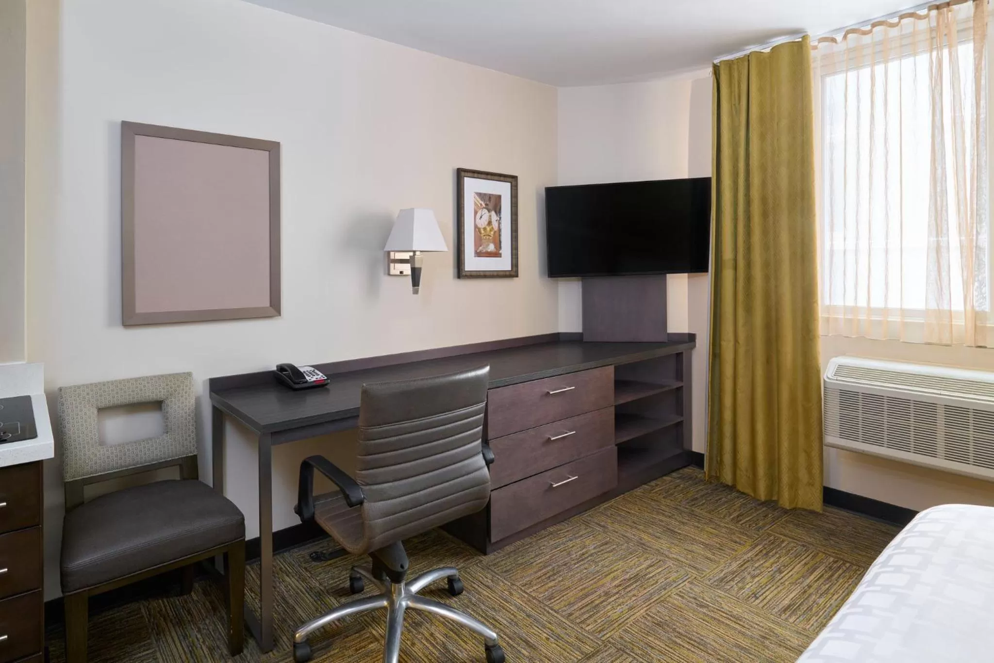 Photo of the whole room, Bed in Candlewood Suites NYC -Times Square by IHG