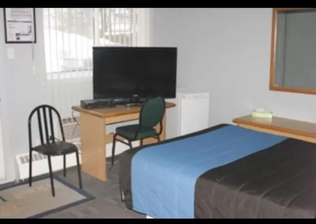 Bed in Motel Le Victo