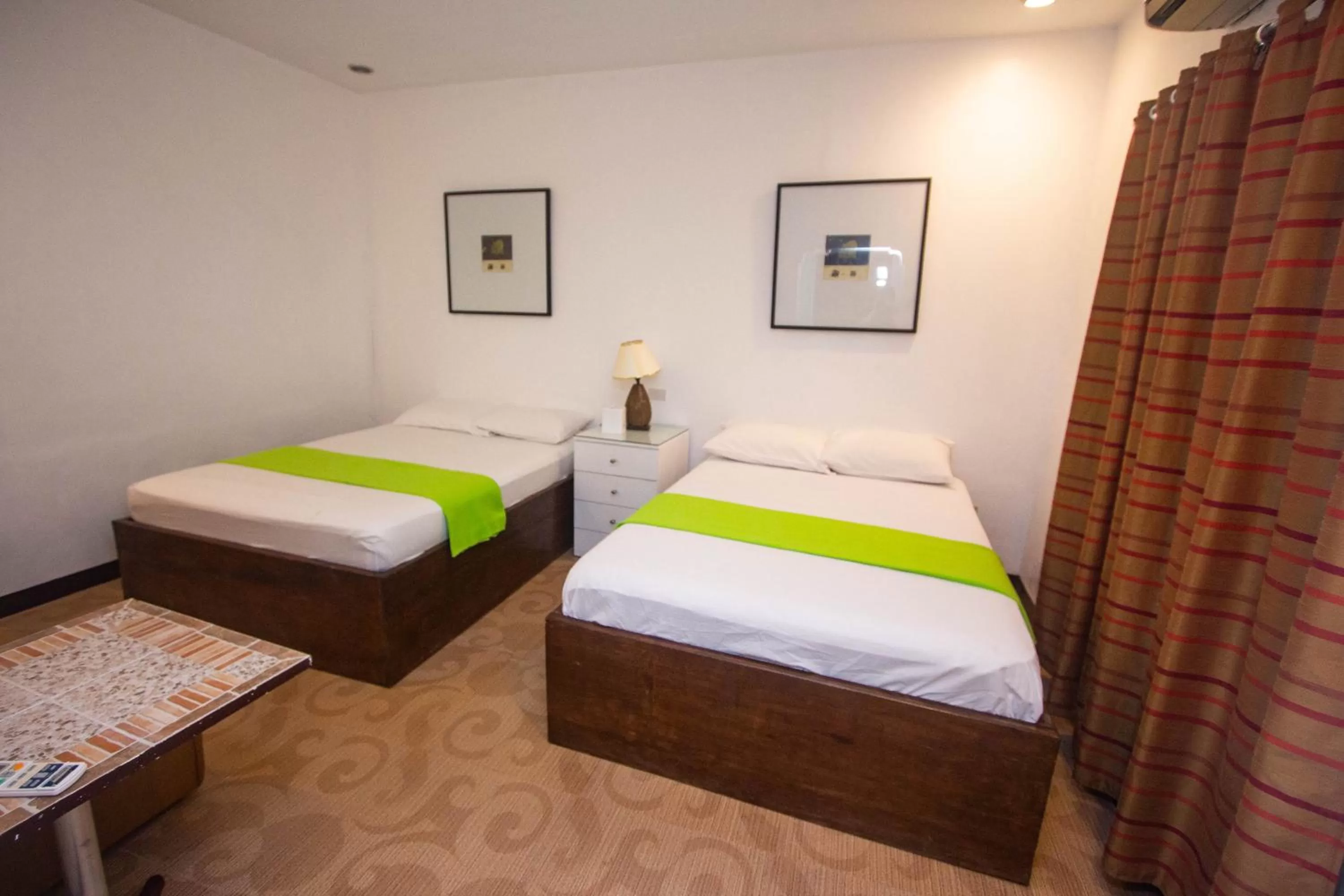 Bed in Raya Del Sol Dive Resort