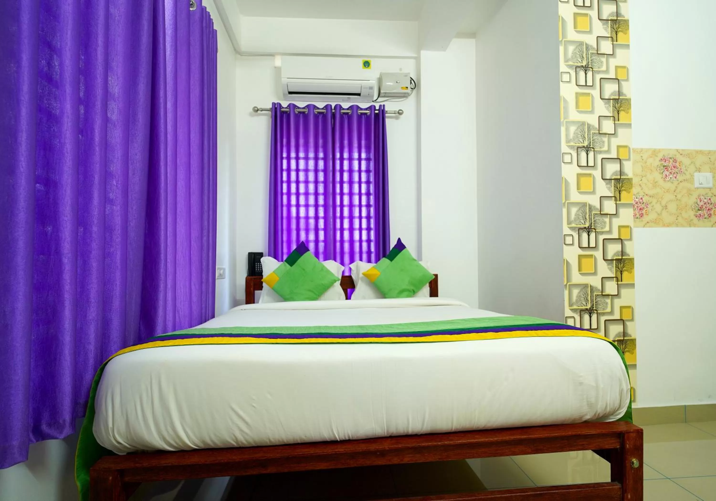 Bed in Treebo Trend Nirupama Apartment