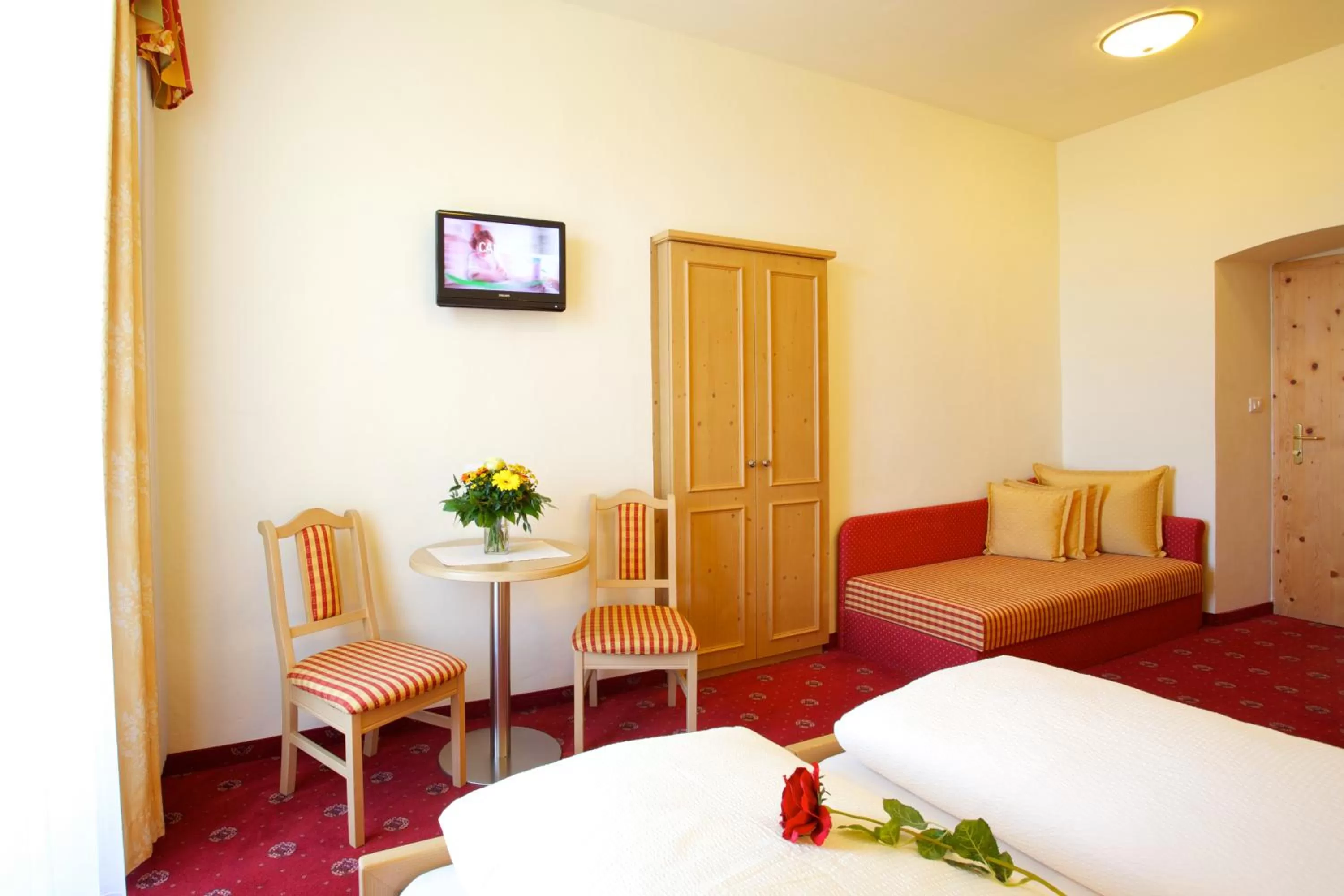 Seating area, Bed in Hotel Castel Latemar