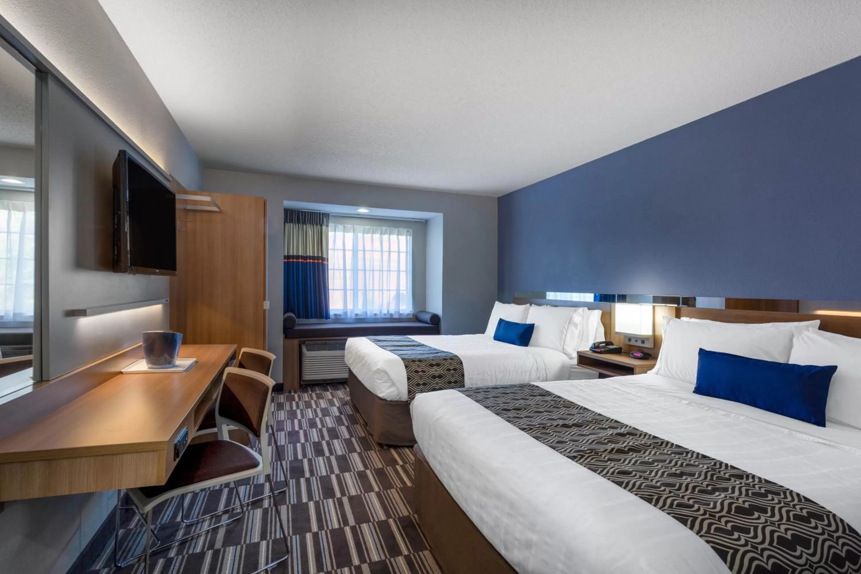 Bed in Microtel Inn & Suites by Wyndham Burlington