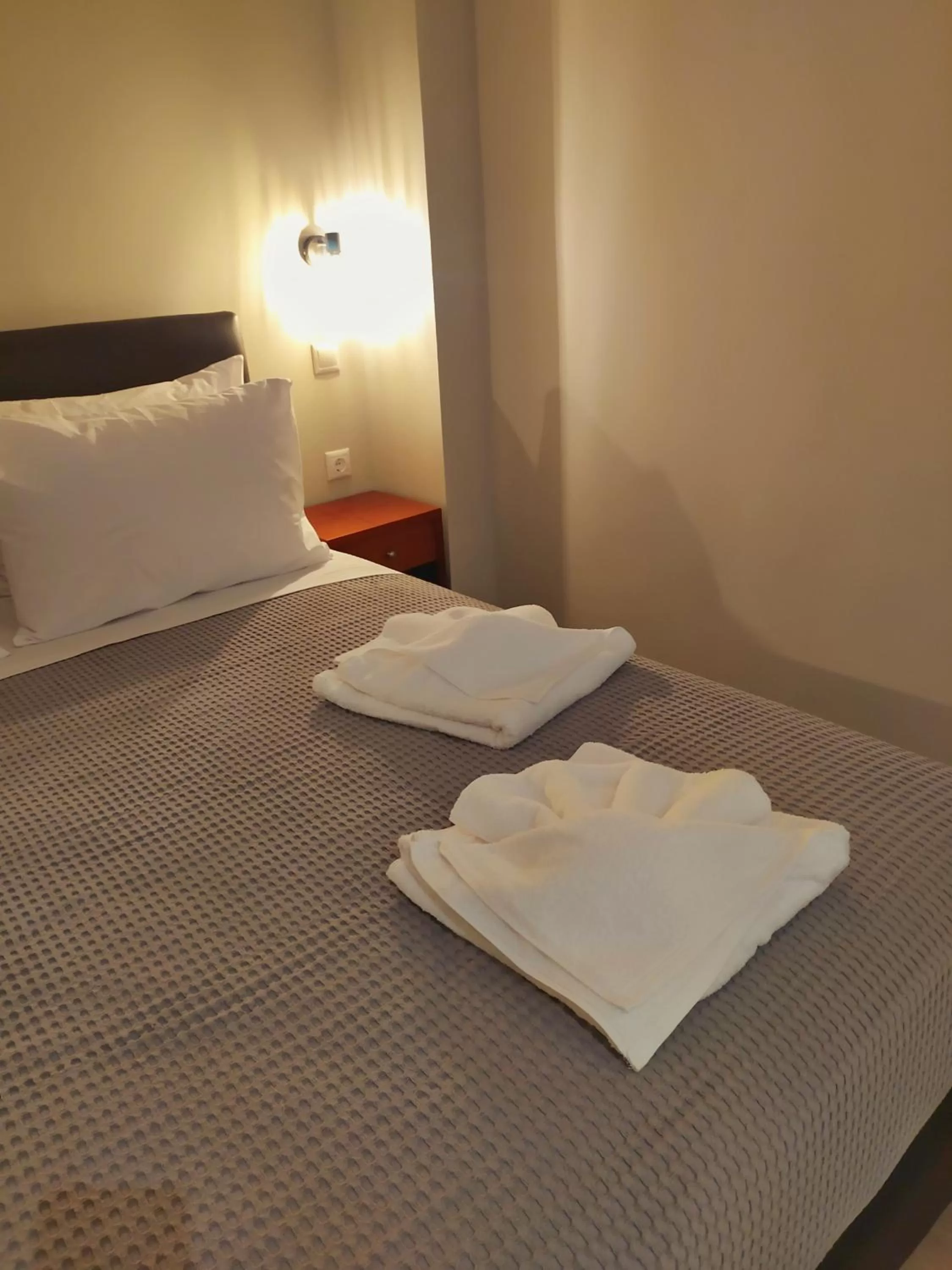 Bed in New Amaryllis Hotel