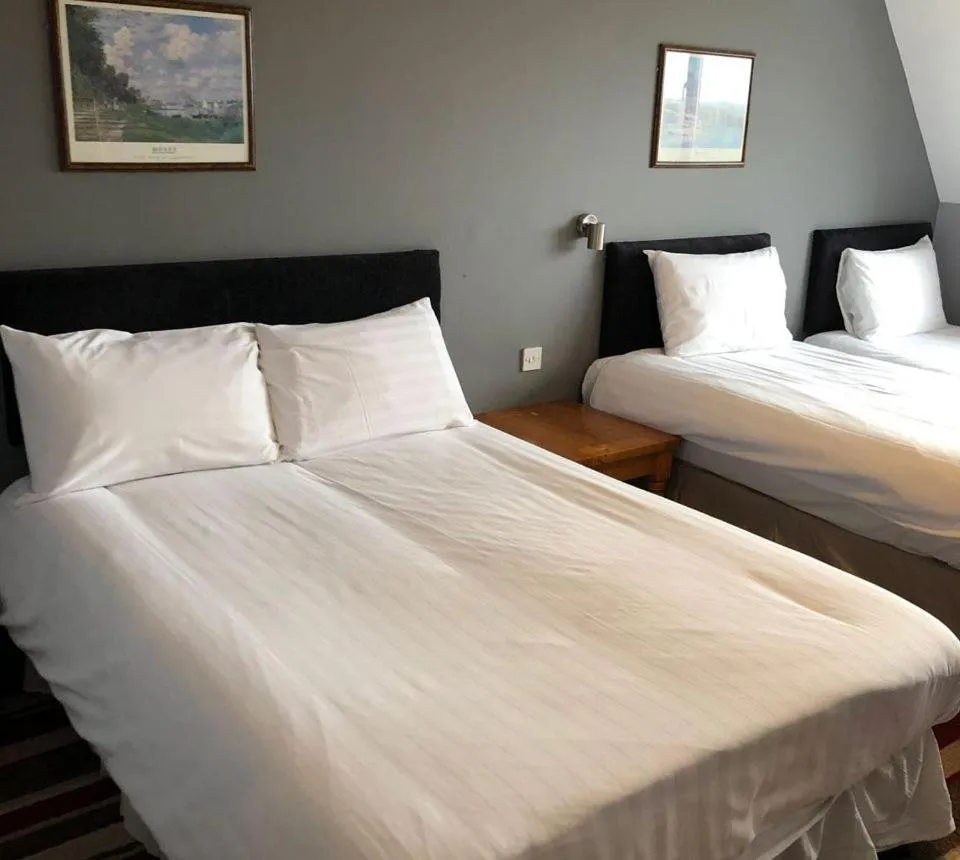 Bed in The Airman Hotel