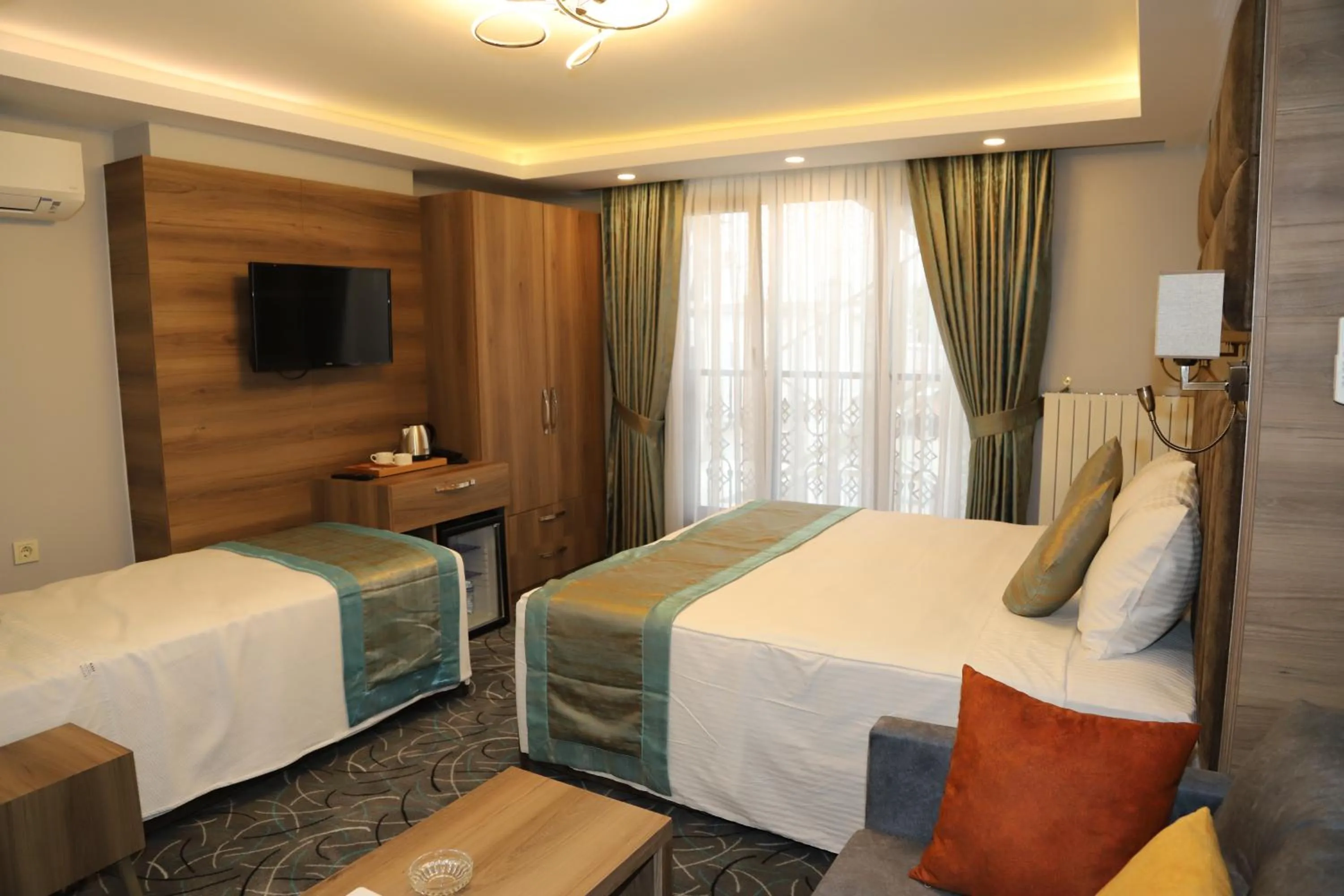 Bed in Grand Kavi Hotel