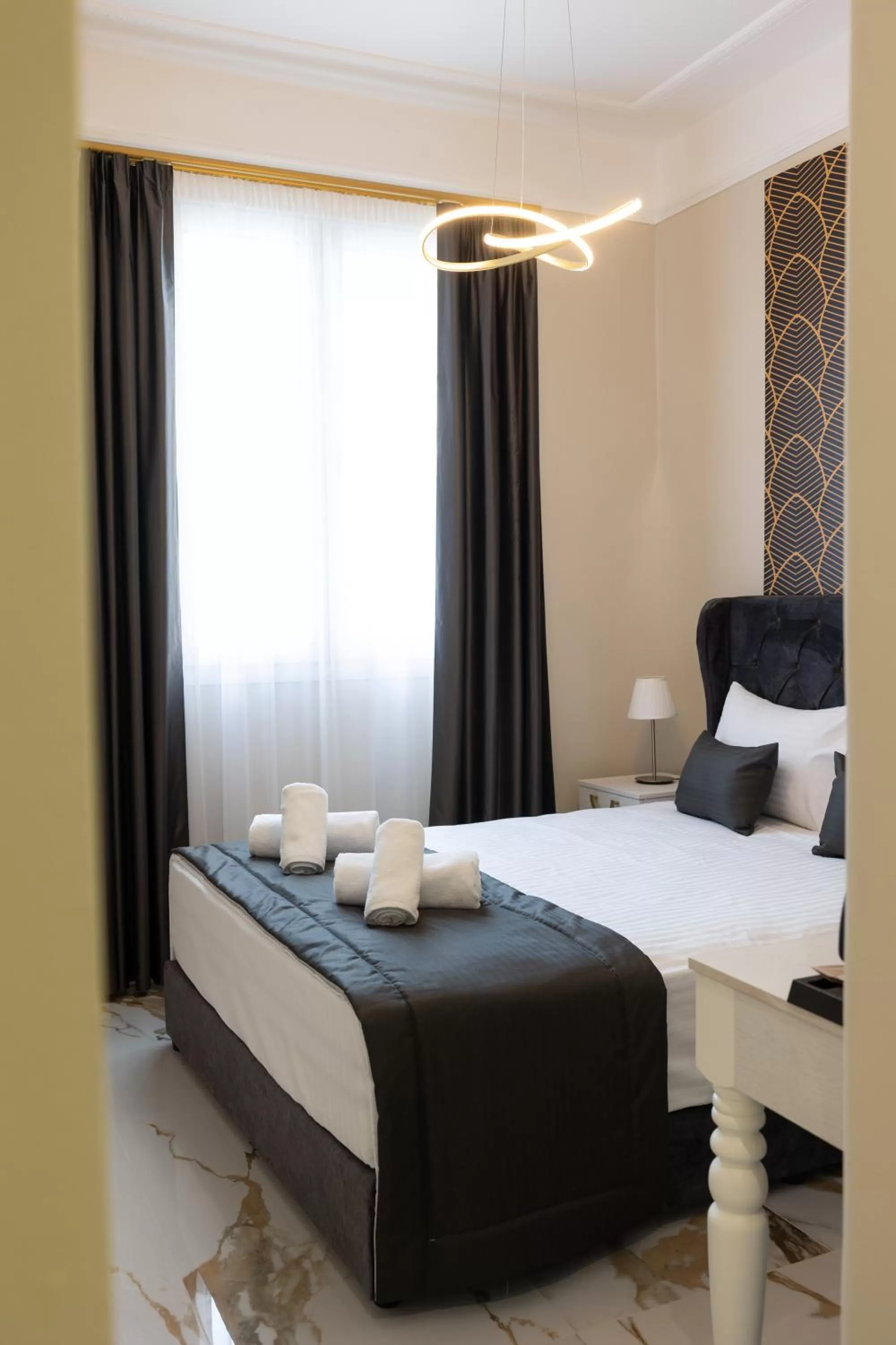 Bed in Modern Revival Luxury Hotel