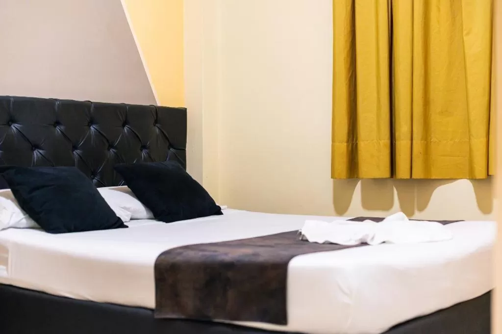 Bed in HOTEL CALLE REAL SUITE