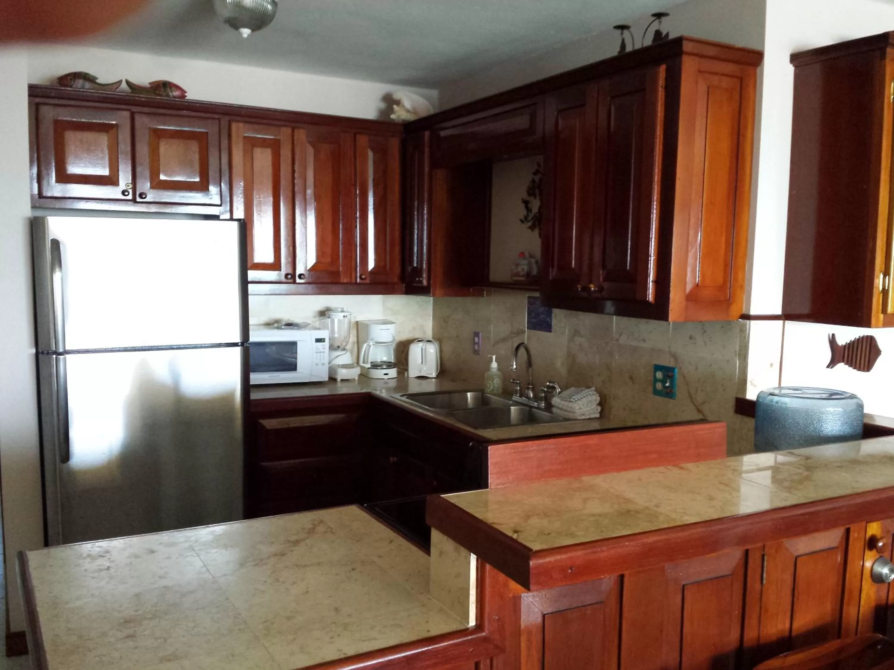 Kitchen or kitchenette in The Palms Oceanfront Suites