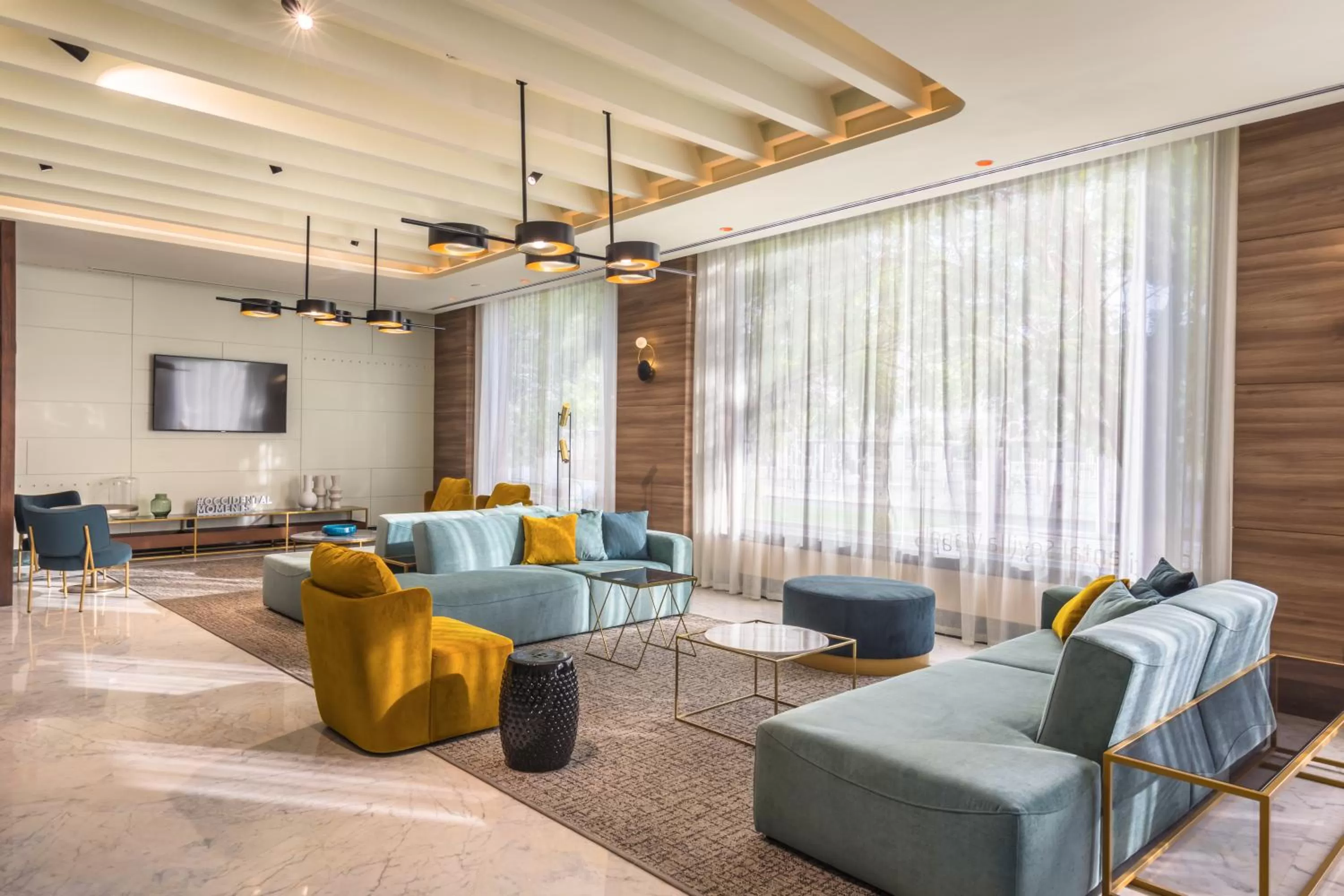 Communal lounge/ TV room in Occidental Sevilla Viapol